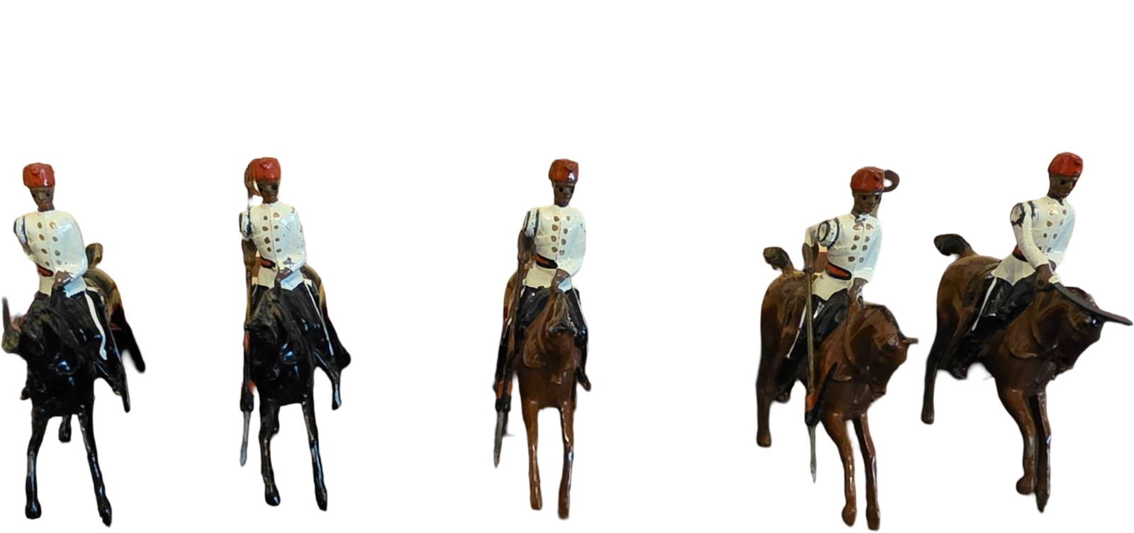 Five Britains Soldiers Toy Set with Mounted Horsemen and Original Box: Five painted metal toy soldiers mounted on horseback by Britains Soldiers, featuring regimental uniforms. The original box reads ‘Regiments of All Nations’ and includes colorful artwork of soldier