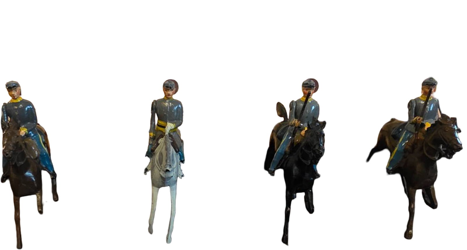 Four Britains Soldiers Toy Set with Original Box, Regiments of All Nations: Four painted metal soldier figurines, each mounted on horseback and manufactured by Britains Ltd. Accompanied by the original box labeled ‘Britains Soldiers, Regiments of All Nations.’ Figurines d