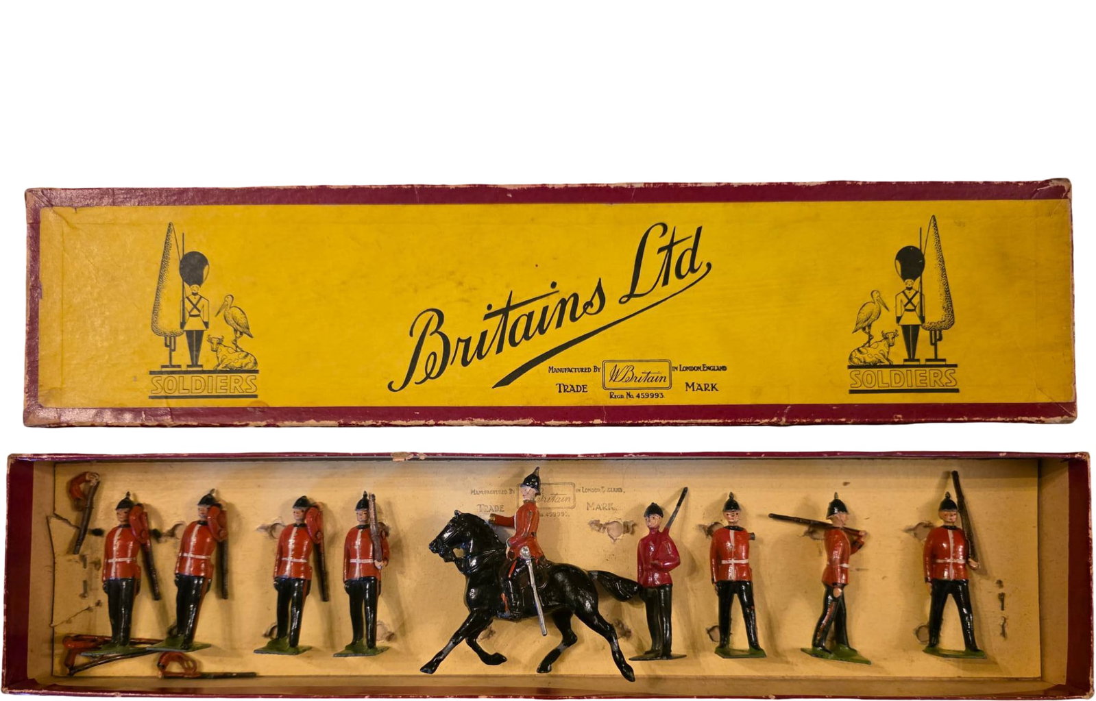 Eight Britains Ltd. Metal Toy Soldiers and Horse Figure in Original Box: Britains Ltd. hand-painted metal toy eight soldiers and one horse-mounted figure in a labeled original box. Includes figures in red uniforms with rifles and a mounted horse figure. The box features