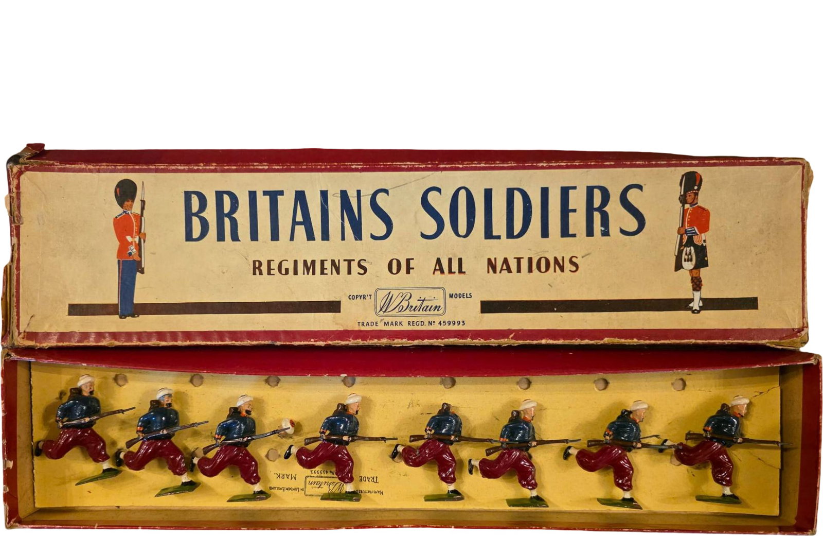 Eight Britains Soldiers ‘Regiments of All Nations’ Set with Running Soldiers: Eight Britains toy soldier set featuring painted metal figures representing running soldiers in colorful uniforms with rifles. Box labeled ‘Regiments of All Nations,’ with original packaging prese