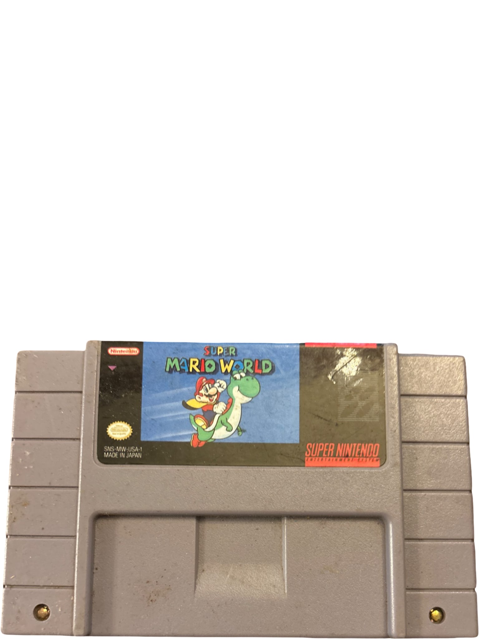 Super Mario World SNES Cartridge, Nintendo, 1990: Super Mario World SNES game cartridge, produced by Nintendo and released in 1990. Gray plastic casing with attached front label featuring the game's title and artwork. Rear label includes legal and