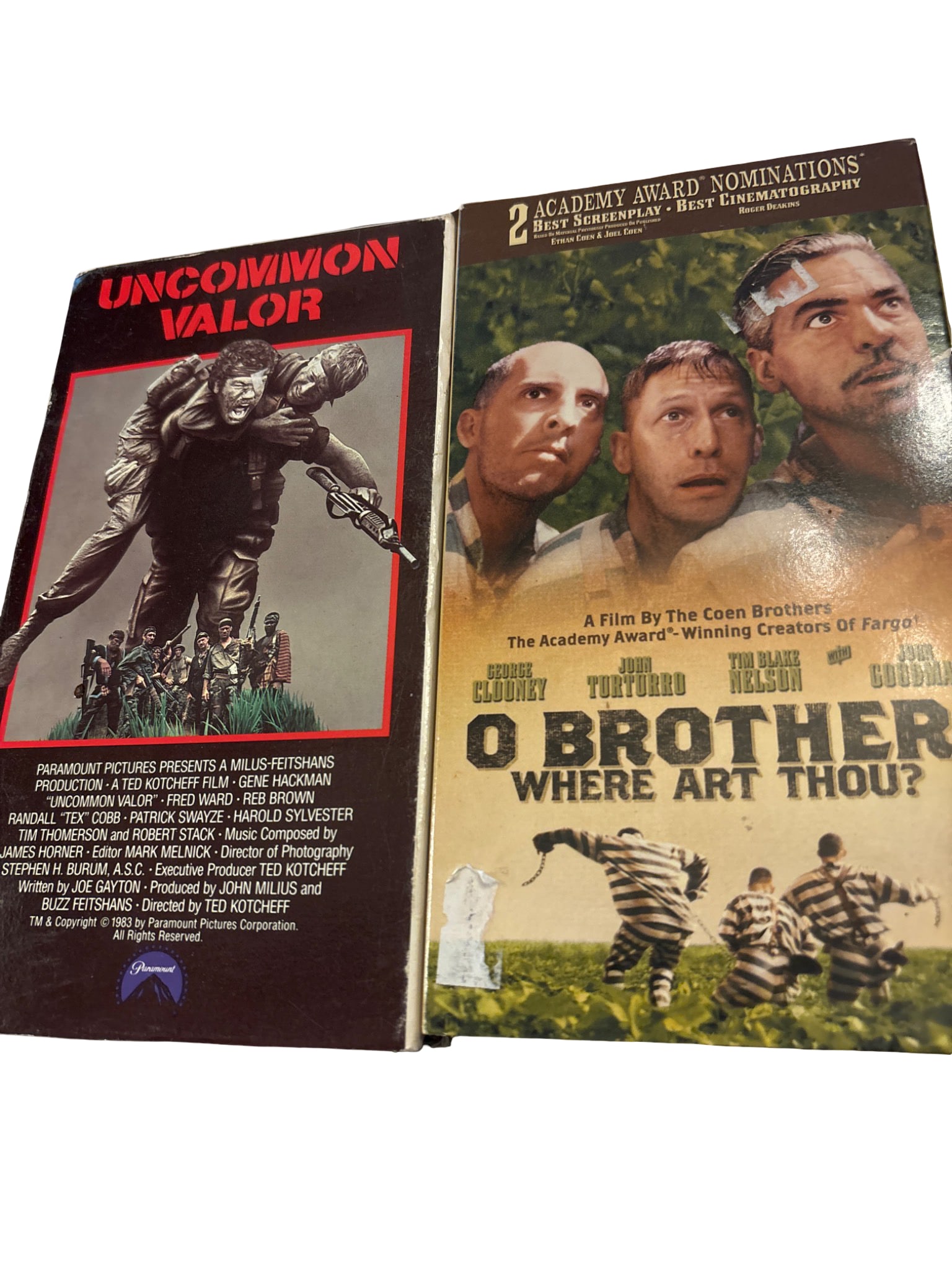 Two VHS Tapes: ‘Uncommon Valor’ and ‘O Brother, Where Art Thou?’: Two VHS tapes: 'Uncommon Valor,' directed by Ted Kotcheff and starring Gene Hackman, released by Paramount Pictures, and 'O Brother, Where Art Thou?' a Coen Brothers film starring George Clooney,