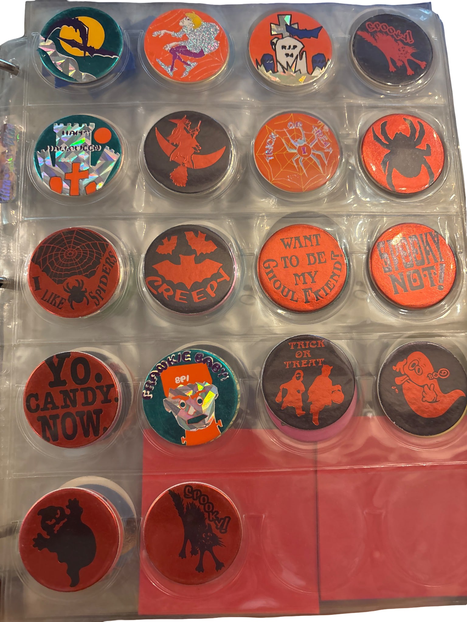 Halloween-Themed Pog Collection: A complete collection of Halloween-themed Pogs featuring various graphics and slogans such as spiders, ghosts, pumpkins, and bats. The set includes vibrant designs celebrating Halloween motifs and col