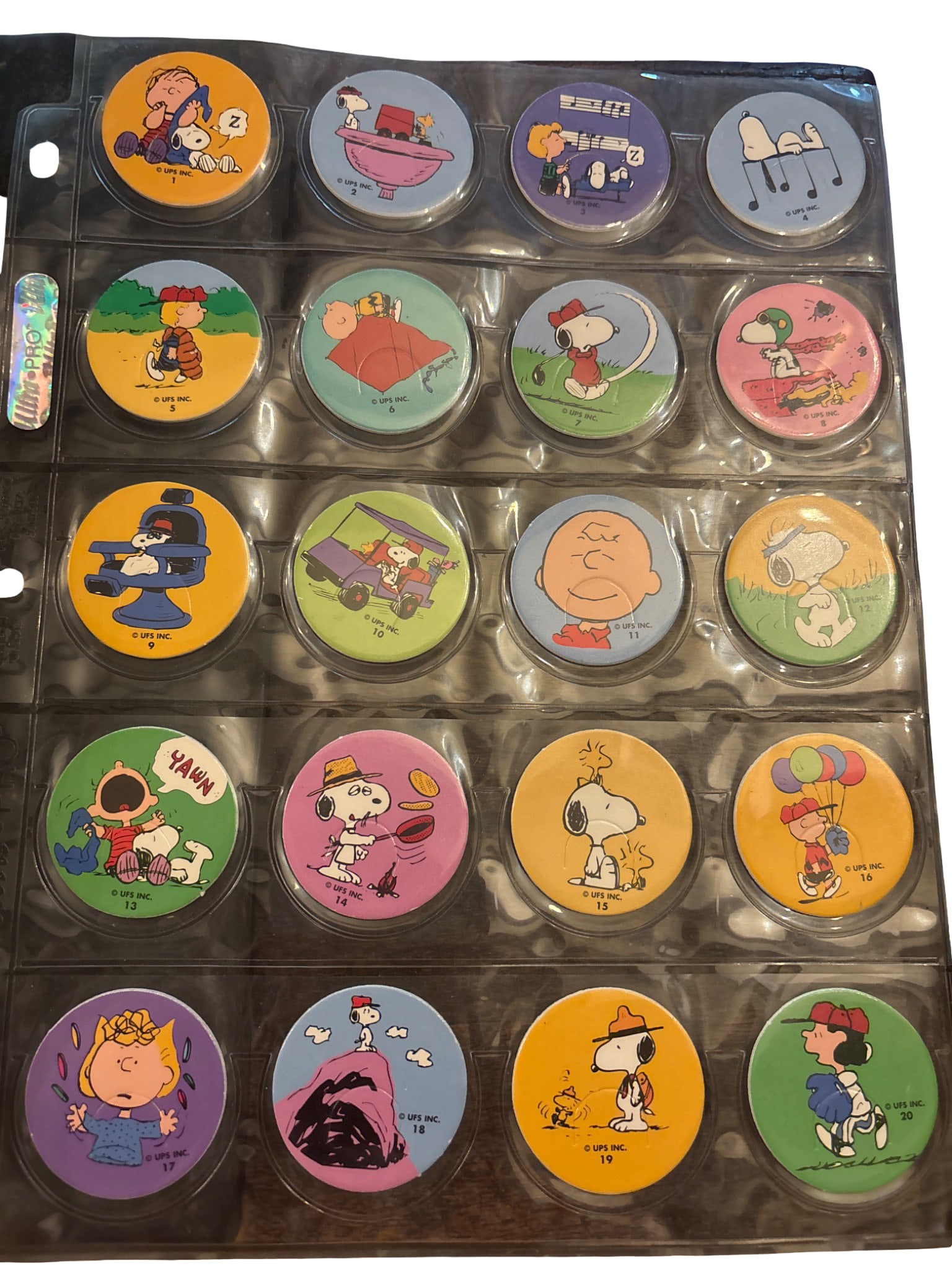 Complete Set of 60 Snoopy & Peanuts-Themed Pogs (1-60) in Display Sheets (1 of 3)