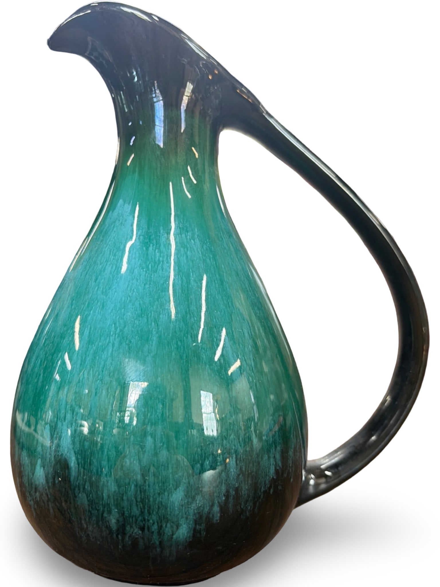 Mid-Century Glazed Ceramic Pitcher in Black and Green Gradient: Glazed ceramic pitcher with a black and green gradient finish, featuring a curvilinear spout and handle. The interior is glazed black, and the base is unglazed, exposing the ceramic material. Minor we