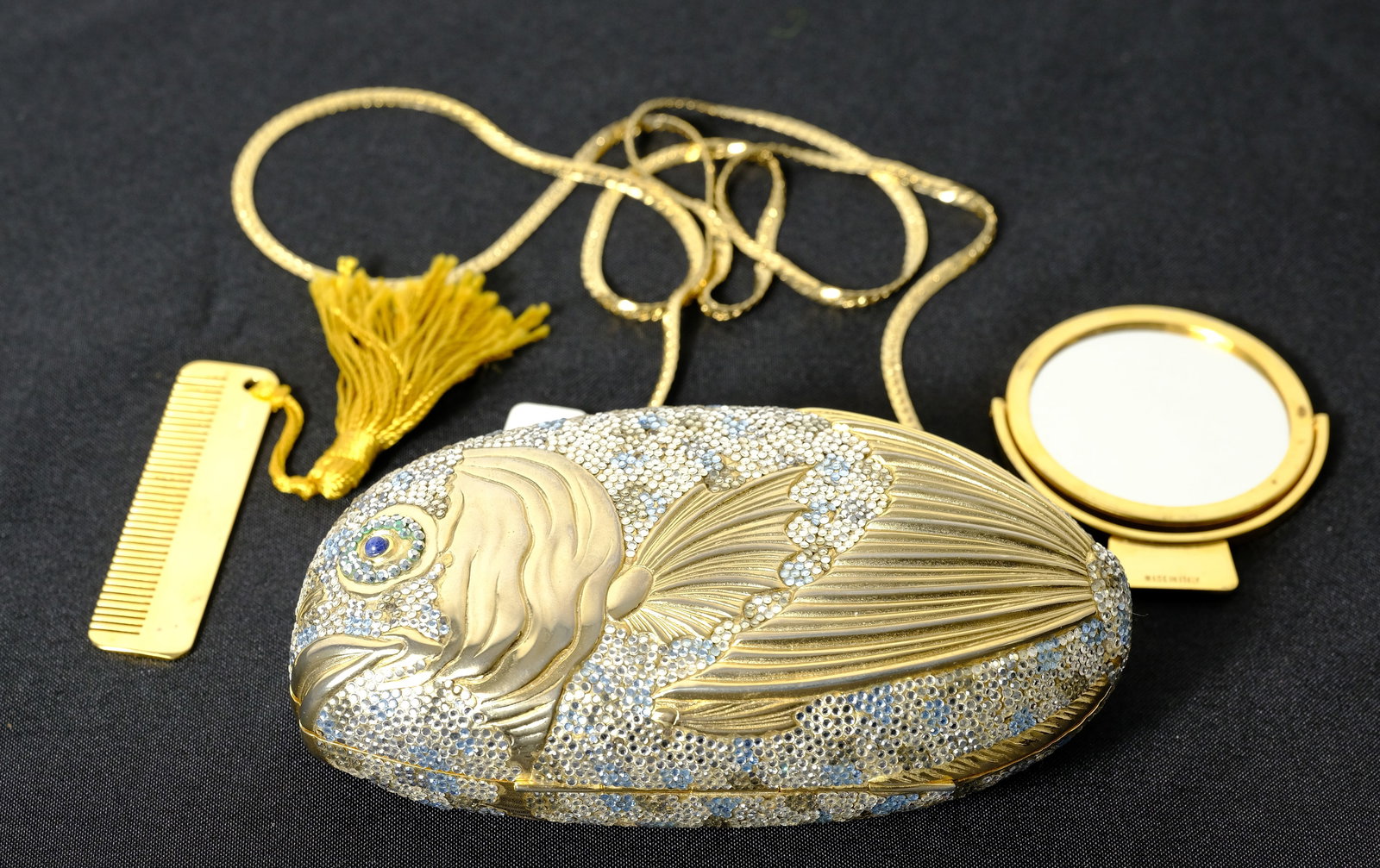 Judith Leiber jeweled coy fish handbag: Vintage jeweled coy fish handbag with mirror and comb L 23 x W 6 in.(handbag w/chain strap) Bag H 3 3/4 x W 6