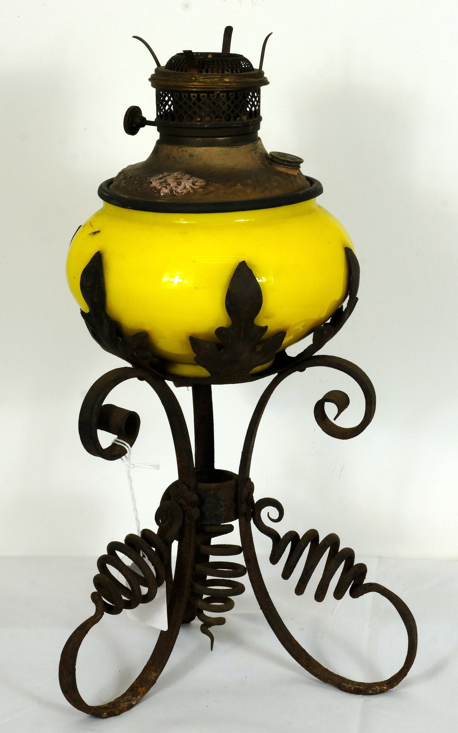 Wrought Iron Oil Lamp: Antique Wrought Iron with Yellow glass bowl Oil lamp H 17 1/4 x W (iron base) 10 in. (Overall size) Diameter of Yellow glass is 8 in.
