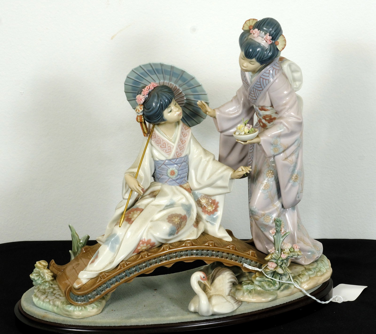Lladro (Ladies on Bridge ) : Vintage porcelain Lladro Ladies on Bridge ) H 11 1/2 x W 13 3/8 in. (Figure w/o wood base) H 12 5/8 x W 14 1/8 in. (Figure w/ wood base)
