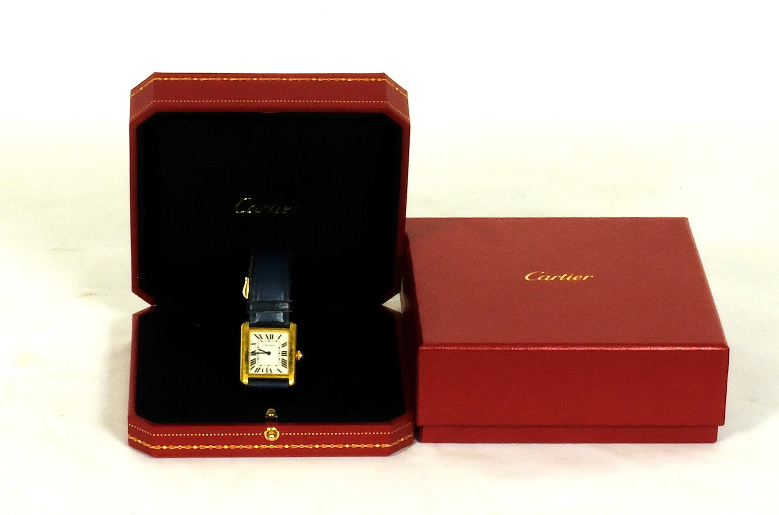Cartier gold Tank mens or unisex watch: Cartier gold Tank Mens or unisex watch with box 5 1/4 inches wide by 5 1/4 inches long by 2 inches Tall