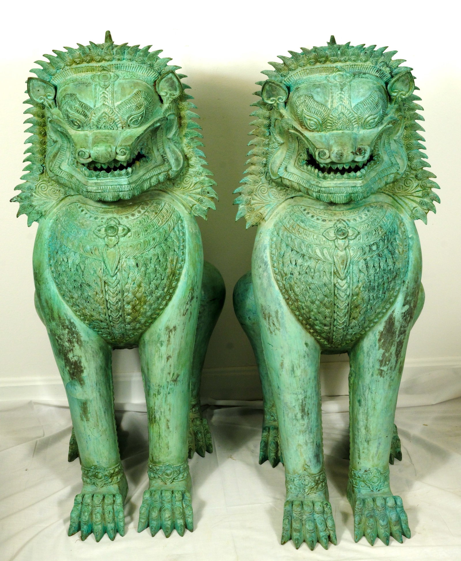 Large Pair Of Bronze Singha Temple Lions, Foo Dogs: A Pair of Thai Mythical Bronze Singha Temple Lions, Foo Dogs viewed as guarding the entrances to many Buddhist Temples 38 1/2 inches tall by 17 inches wide by. 20 inches deep