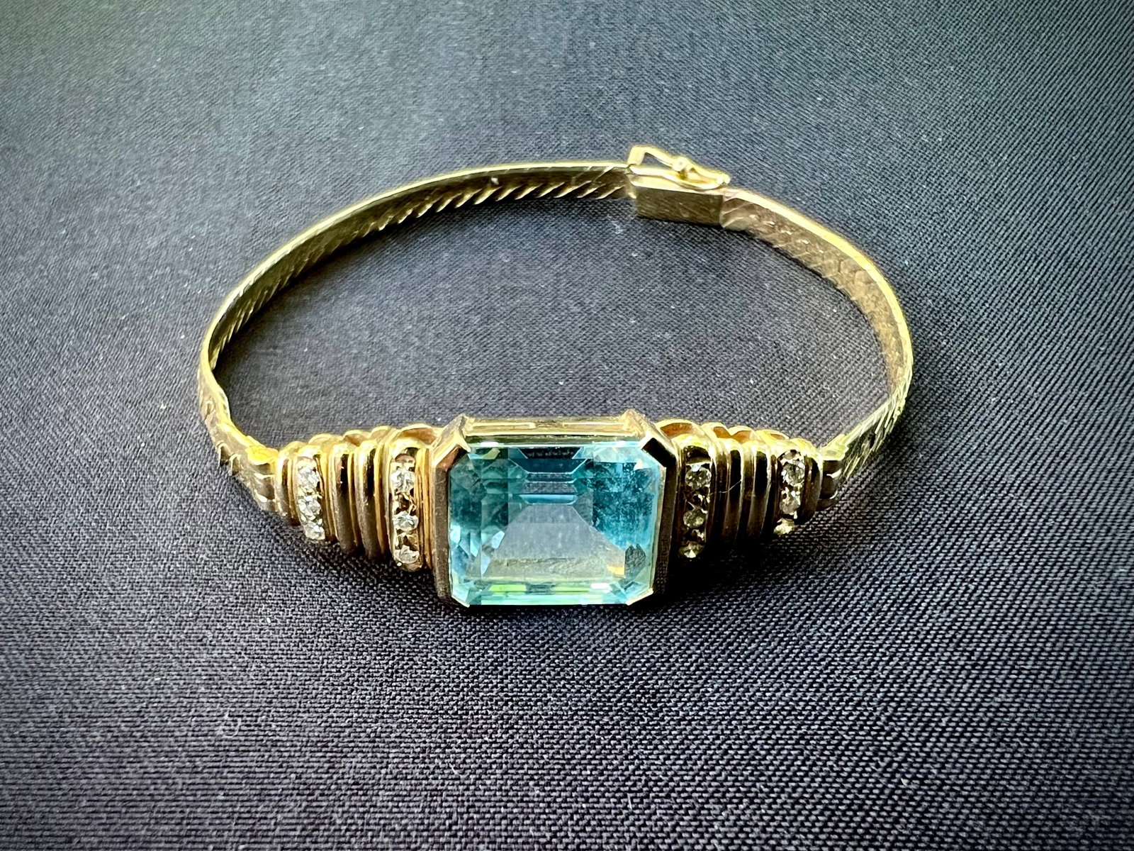 14K Gold bracelet with Blue topaz and Diamonds.: 14K Gold bracelet with Blue topaz and Diamonds. 10.2 gramsLength 6 3/8 inches Stone: 1/2 inch x 3/8 inch