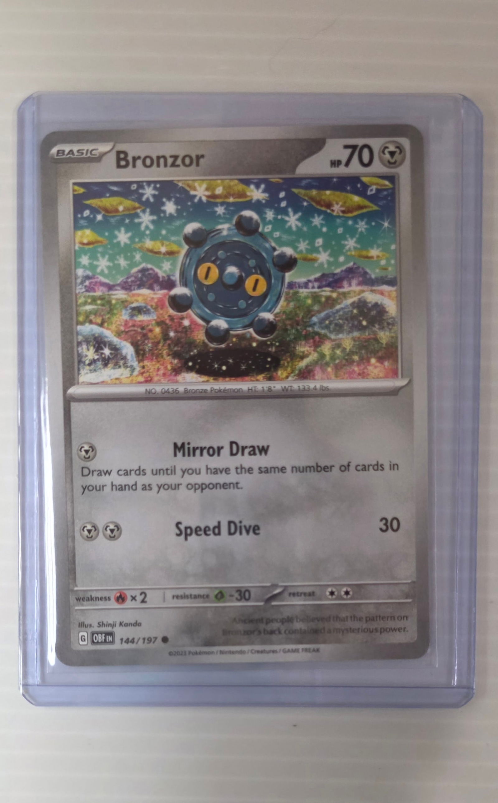 Bronzor 144/197 Obsidian Flames Raw Pokemon Card in Top Loader (1 of 5)