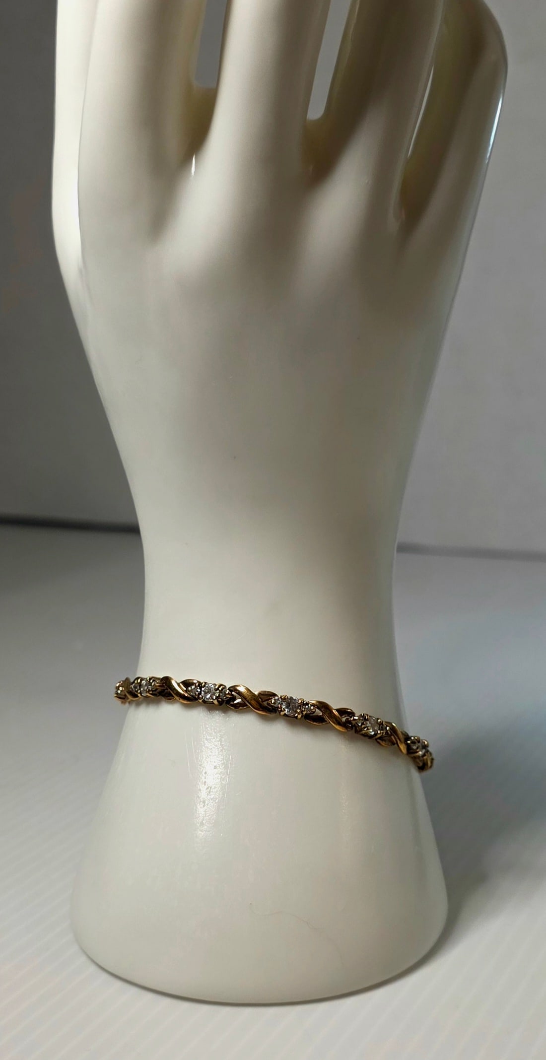 Vintage 925 Sterling Silver Gold Plated Tennis Bracelet S Link CZ Style Hidden Clasp: Vintage 925 sterling silver gold plated tennis bracelet featuring a crisscross “S” link design with clear stone accents. Marked 925 and FAS inside clasp. Stones untested. Hidden box clasp with