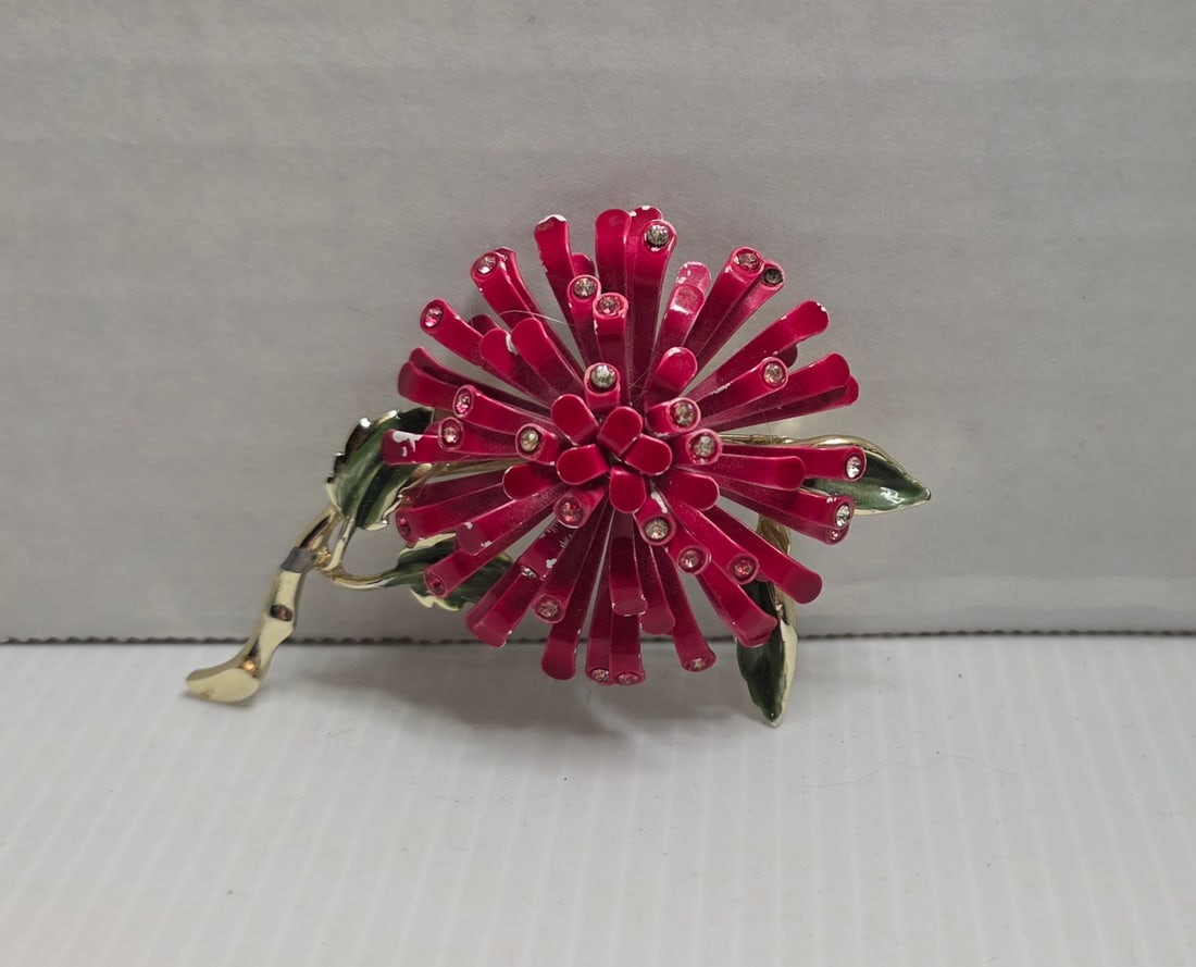 Vintage Red Enamel Starburst Chrysanthemum Brooch Rhinestone Floral Pin: Vintage enamel floral brooch commonly referred to as a starburst or chrysanthemum design. Features curled red enamel petals accented with small clear rhinestones at the tips, set on a gold tone base w