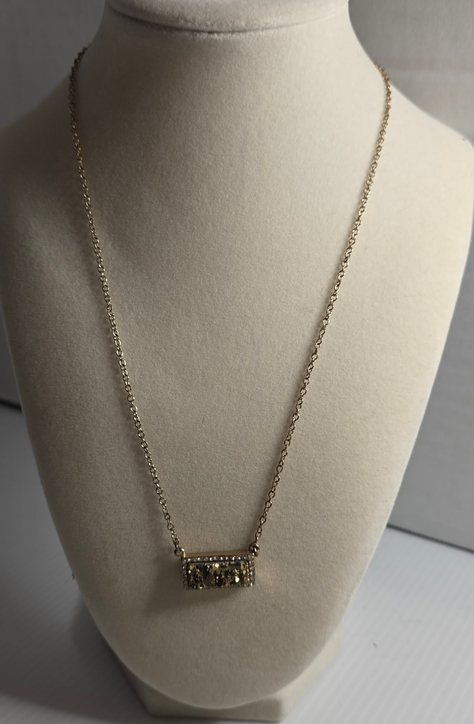 Gold Tone Druzy Style Bar Pendant Necklace CZ Crystal Halo Statement: Gold tone necklace featuring rectangular bar pendant with sparkly gold druzy style center stone, surrounded by clear CZ style crystal halo. Cable link chain with lobster clasp closure. Only clasp reac