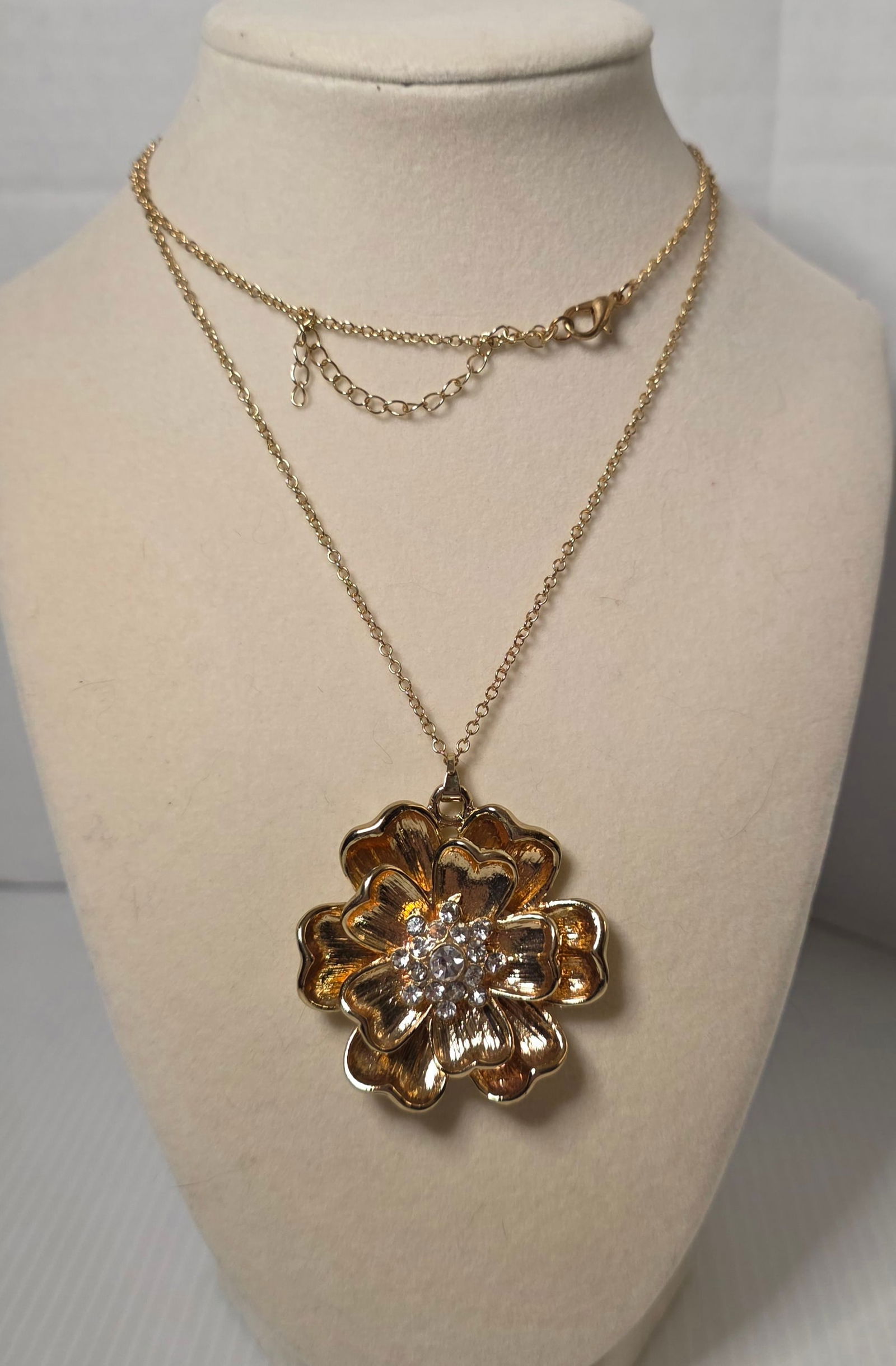 Large Gold Tone Flower Pendant Necklace Long Chain Rhinestone Statement: Oversized gold tone flower pendant necklace featuring layered petal design with textured finish and central cluster of clear rhinestones. Extra long chain with lobster clasp and extender. All chain co