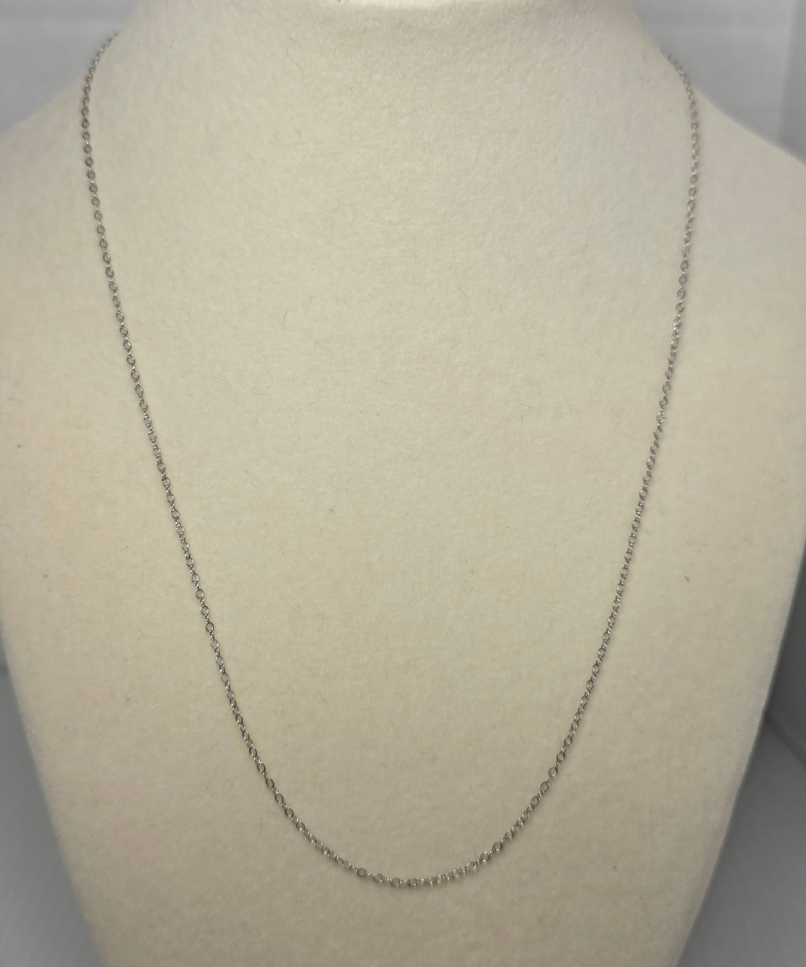 Sterling Silver Fine Chain Necklace Signed Clasp: Delicate sterling silver fine link chain necklace with spring ring clasp marked STERLING. Minimalist everyday style suitable for layering or pendant wear. Measures approximately 18 inches end to end.
