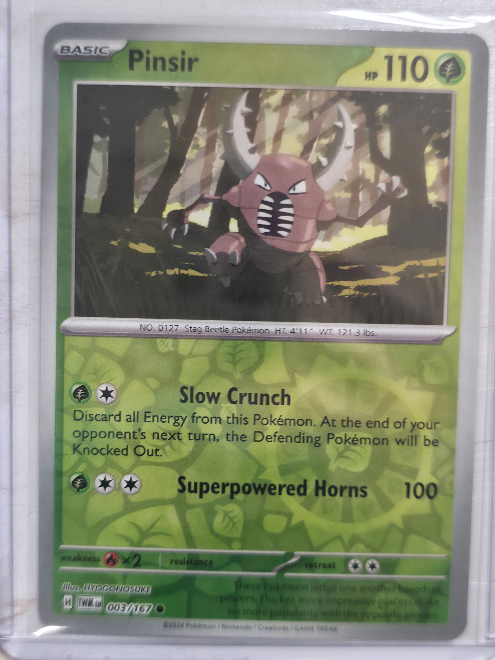 2024 Pinsir Twilight Masquerade 003/167 Rare Reverse Holo: Background shows reflective foil pattern outside artwork frame, confirming Reverse Holo version. Set symbol and numbering match Twilight Masquerade 003/167.Description:Pinsir Basic Grass Pokemon. Twil