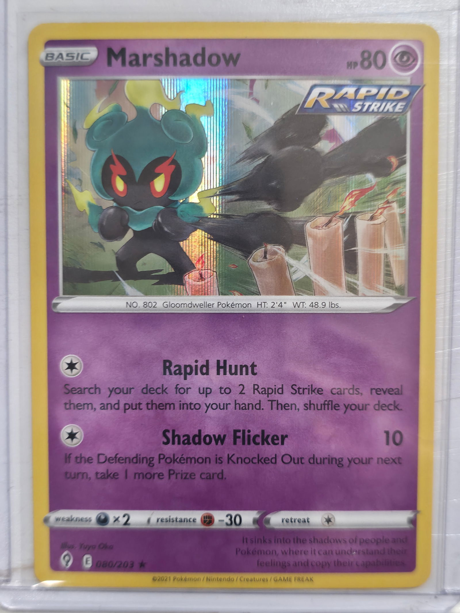 2021 Marshadow Evolving Skies 080/203 Holo Rare: Marshadow Basic Psychic Pokemon. Evolving Skies set. Card number 080/203. Holo rare with vertical holo foil pattern in artwork window. Rapid Strike designation. Illustrated by Yugo Oka. 2021 Pokemon N