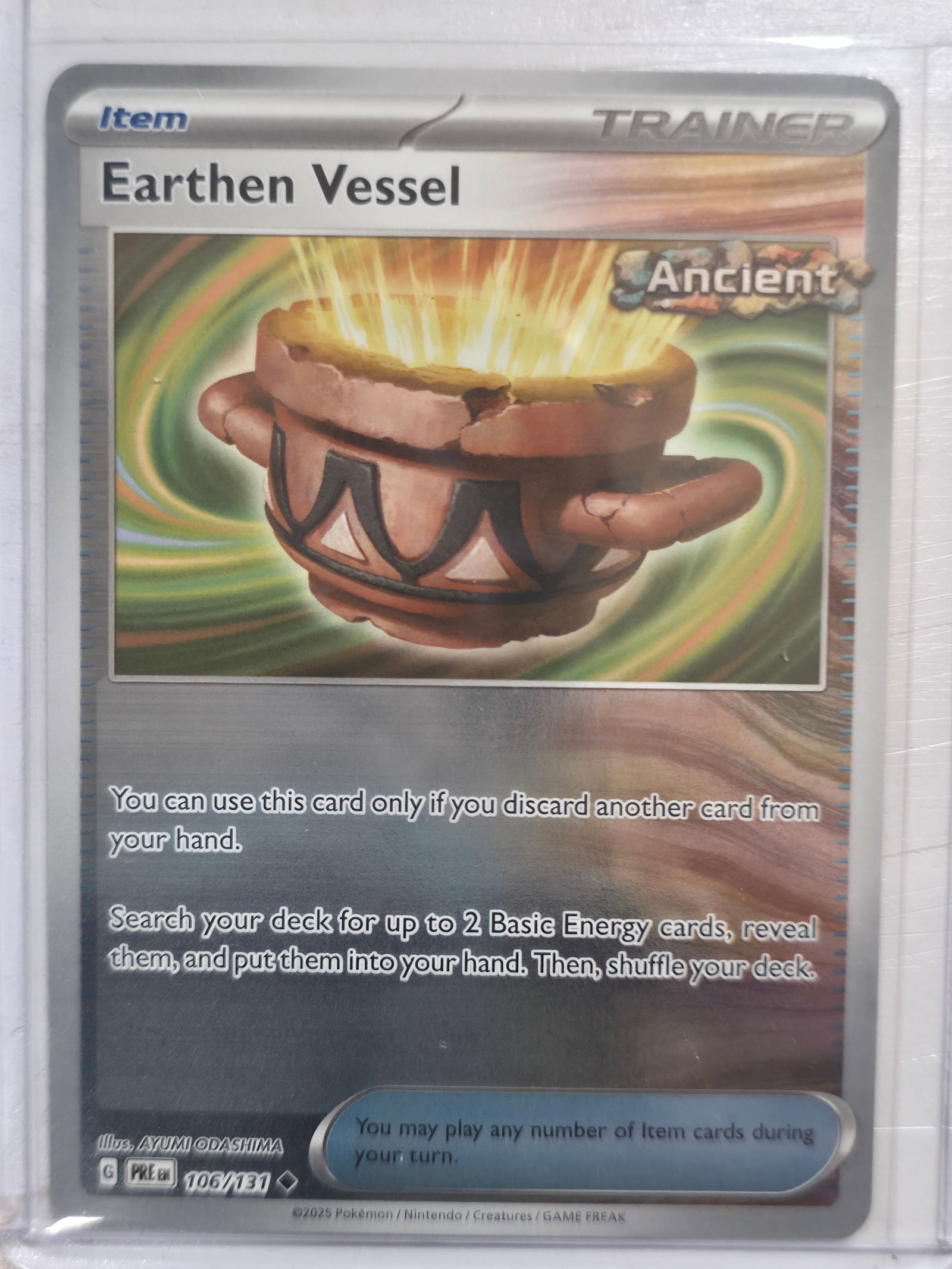 2025 Earthen Vessel Paradox Rift 106/131 Reverse Holo: Earthen Vessel Item Trainer card. Paradox Rift set. Card number 106/131. Reverse holo. Ancient designation. Illustrated by Ayumi Odashima. 2025 Pokemon Nintendo Creatures GAME FREAK. Pre EN print. Pre