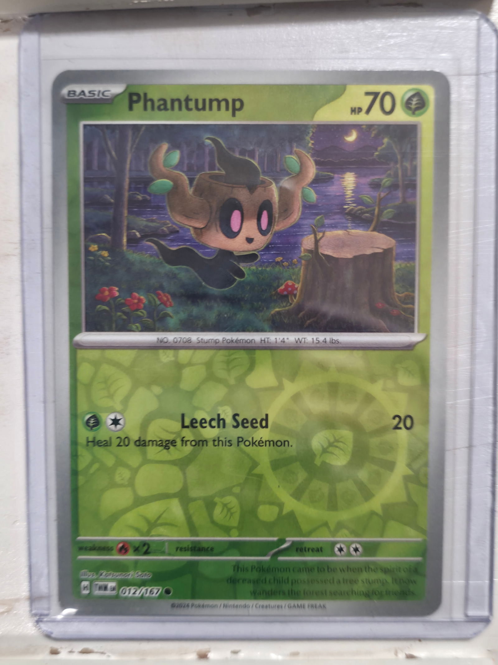 2024 Phantump Twilight Masquerade 012/167 Common: 2024 Phantump Basic Grass Pokemon. Twilight Masquerade set. Card number 012/167. Common non holo. HP 70. Illustrated by Kazumasa Sato. Regulation mark H. Preowned card stored in penny sleeve and top l