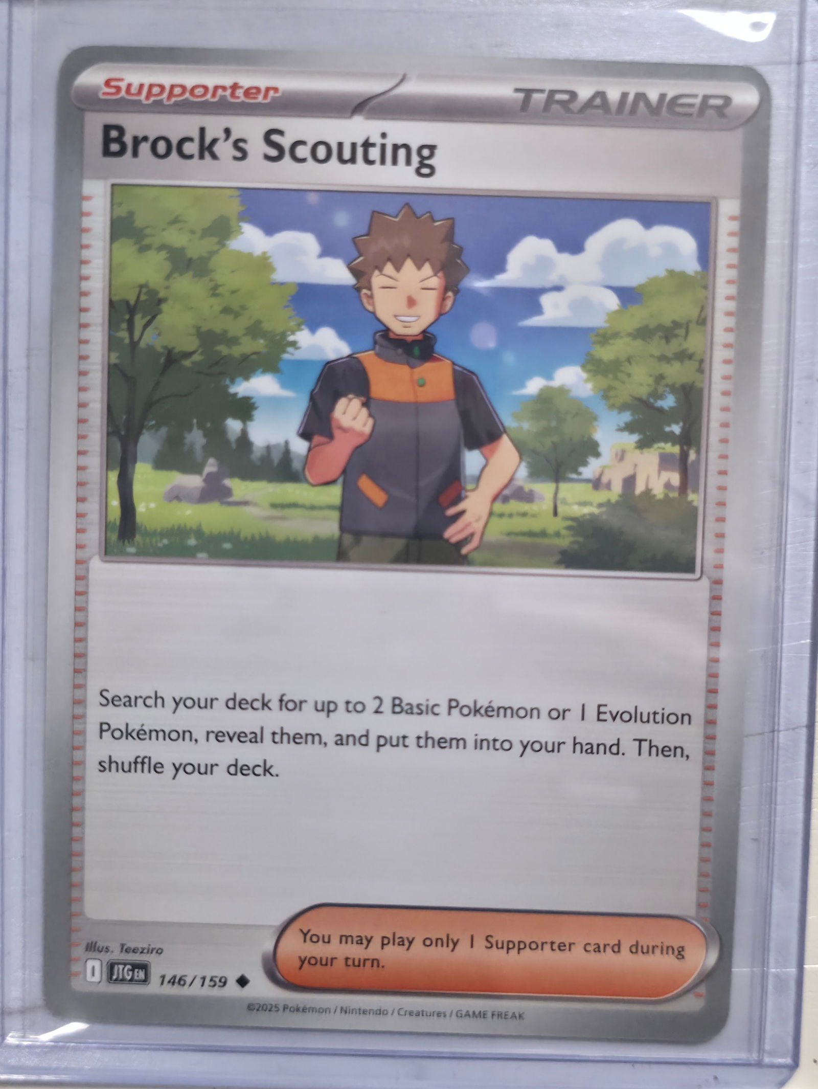 2025 Brock's Scouting 146/159 Trainer Supporter: 2025 Brock's Scouting Trainer Supporter card. Card number 146/159. Search your deck for up to 2 Basic Pokemon or 1 Evolution Pokemon, reveal them, and put them into your hand, then shuffle your deck.