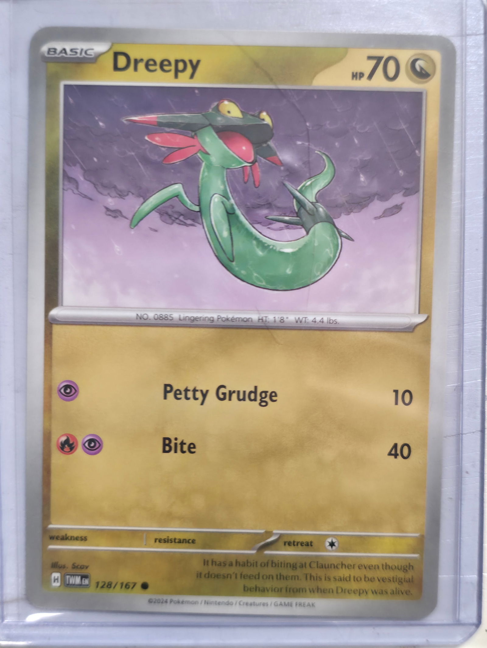 2024 Dreepy Twilight Masquerade 128/167: 2024 Dreepy Basic Psychic Pokemon. Twilight Masquerade set. Card number 128/167. HP 70. Attacks Petty Grudge 10 and Bite 40. Illustrated by Scav. Regulation mark H. Non holo. Preowned card stored in