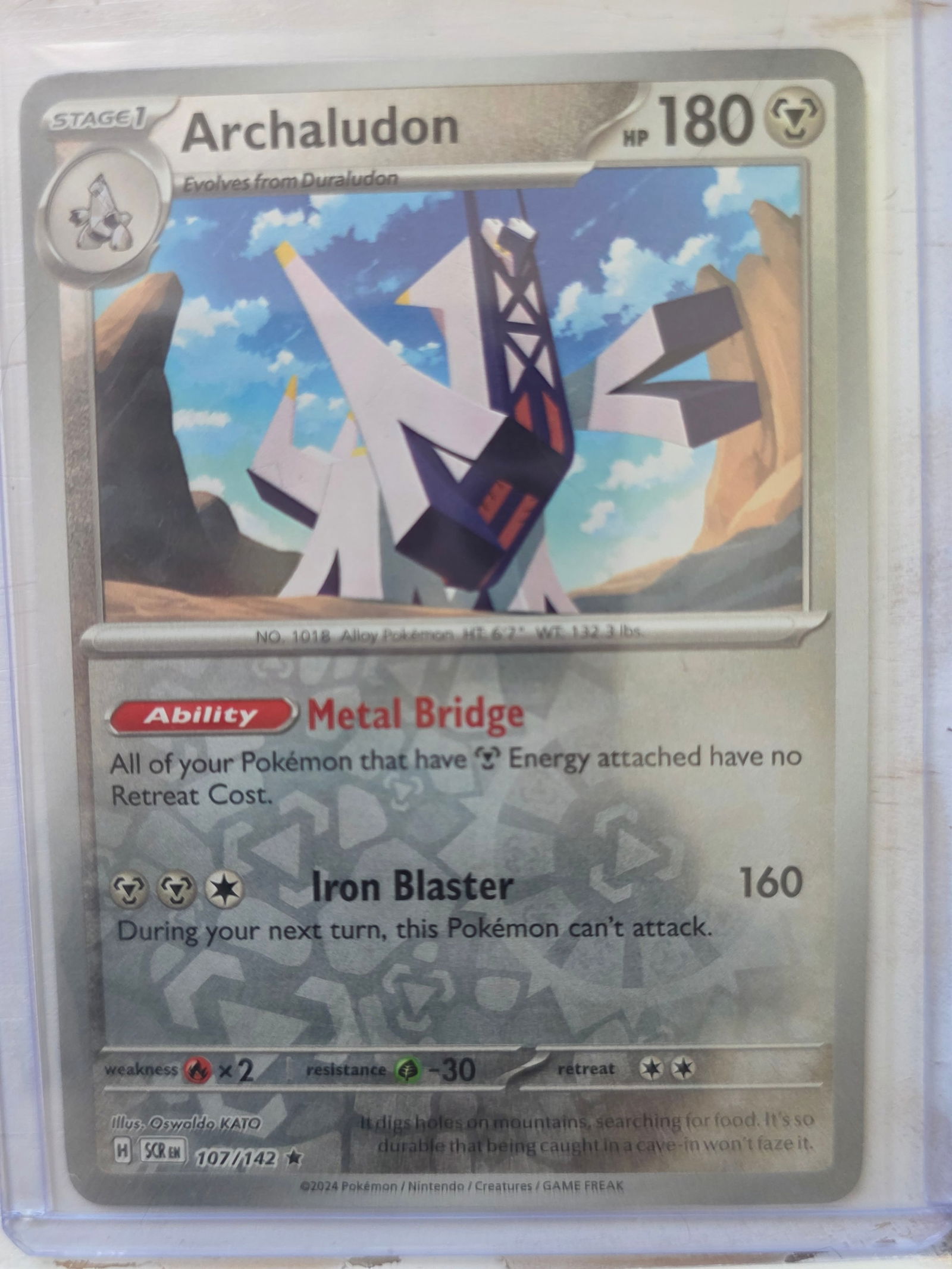 2024 Archaludon SV Base 107/142 Holo: 2024 Archaludon Stage 1 Metal type Pokemon. Evolves from Duraludon. Scarlet and Violet Base set. Card number 107/142. HP 180. Ability Metal Bridge. Attack Iron Blaster 160. Holo foil front. Preowned c