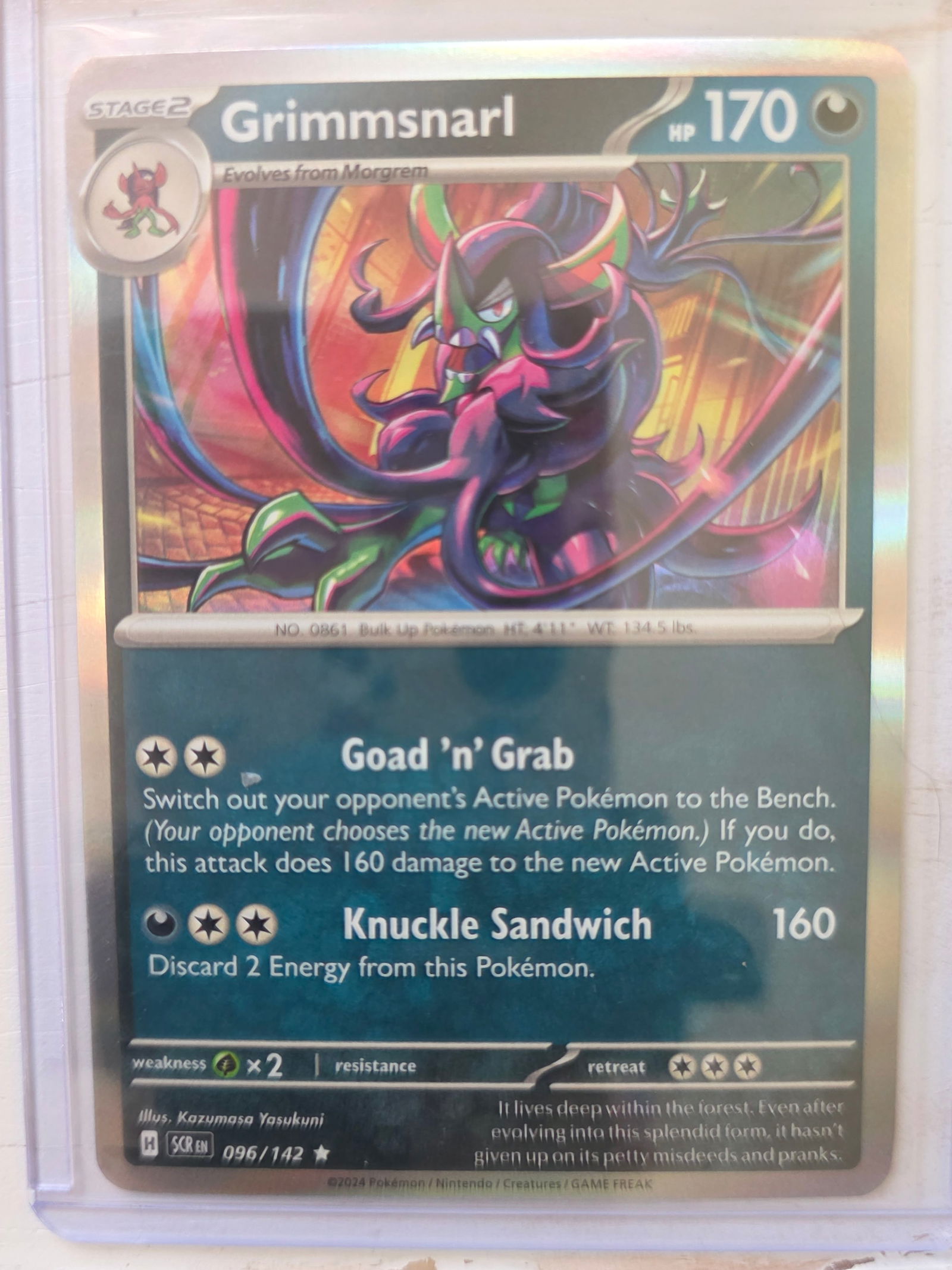 2024 Grimmsnarl SV Base 096/142 Holo Rare: 2024 Grimmsnarl Stage 2 Darkness type Pokemon. Evolves from Morgrem. Scarlet and Violet Base set. Card number 096/142. HP 170. Attacks Goad n Grab and Knuckle Sandwich 160. Holo foil card front. Preow