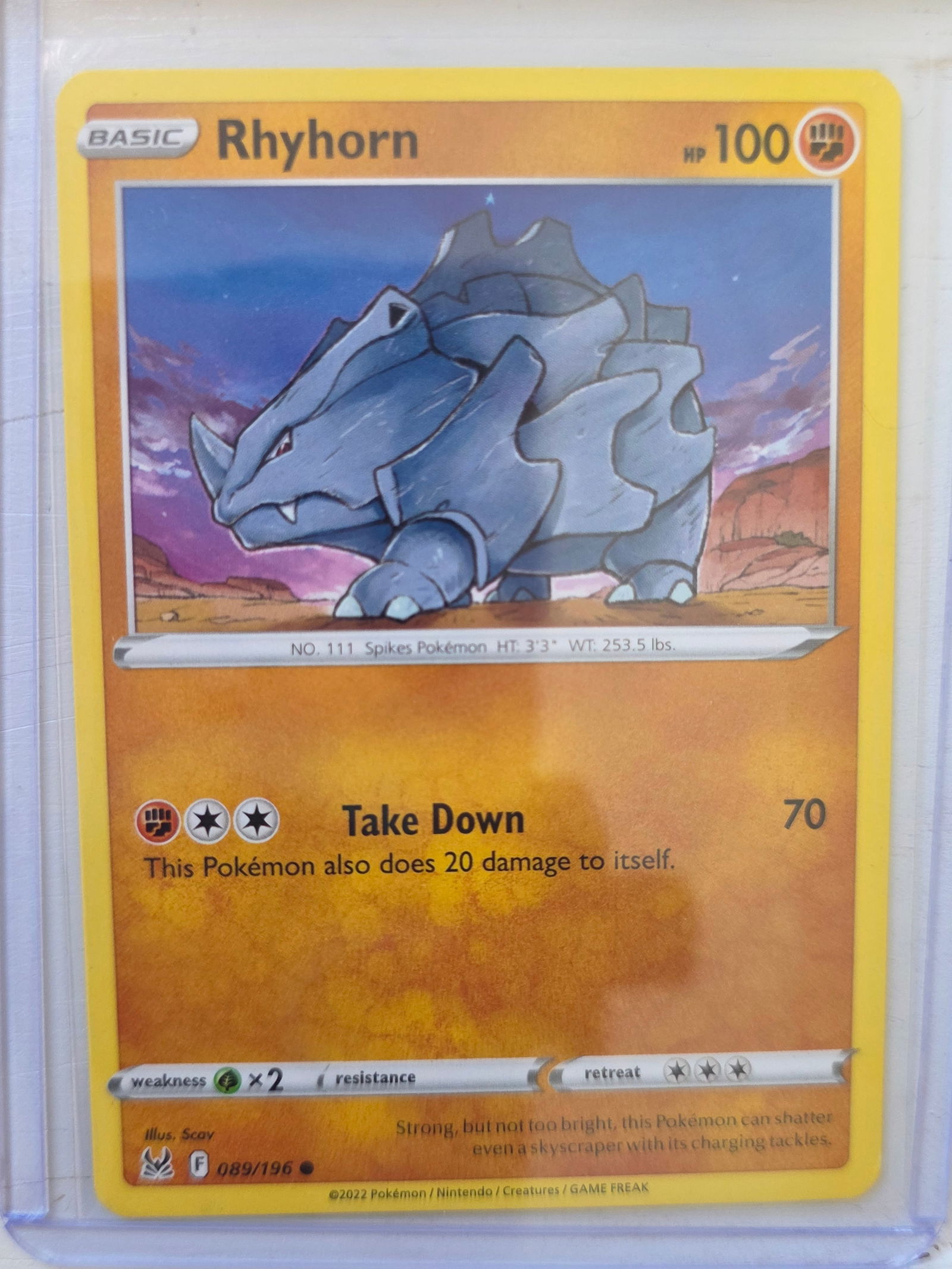 2022 Rhyhorn Lost Origin 089/196 Pokemon Card: 2022 Pokemon Rhyhorn card numbered 089/196 from the Sword & Shield Lost Origin expansion set. Illustrated by Scav. Card stored in penny sleeve and top loader.