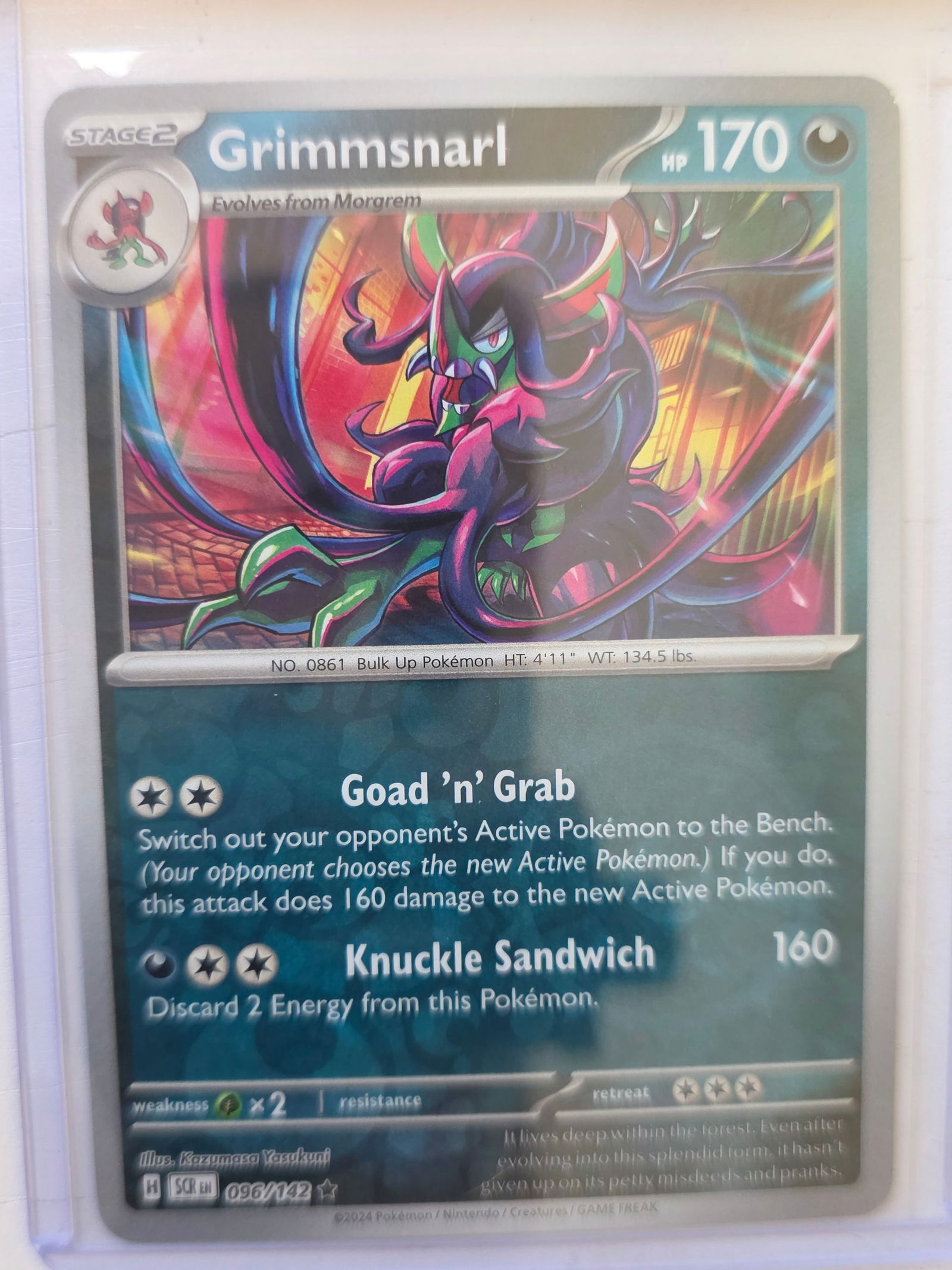2024 Grimmsnarl Stellar Crown 096/142 Reverse Holo Pokemon Card: 2024 Pokemon Grimmsnarl reverse holo card numbered 096/142 from the Scarlet & Violet Stellar Crown expansion set. Stage 2 Pokemon evolving from Morgrem. Illustrated by Kazumasa Yasukuni. Reverse holog