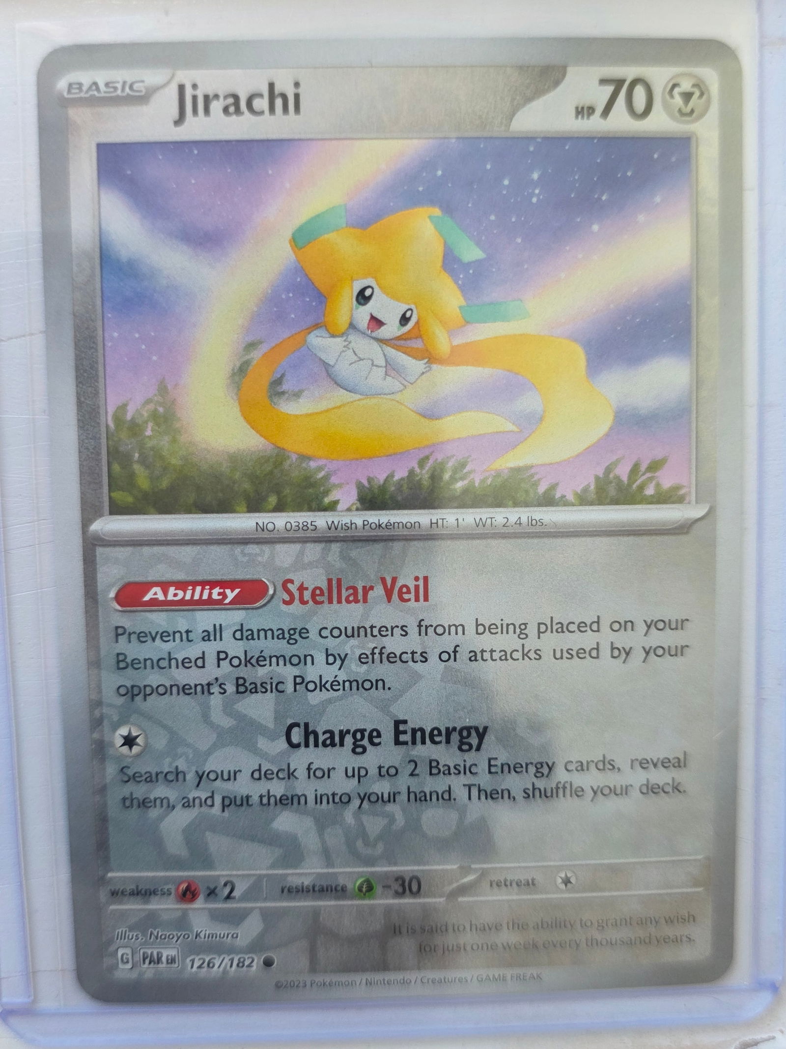2023 Jirachi Paradox Rift 126/182 Reverse Holo Pokemon Card: 2023 Pokemon Jirachi reverse holo card numbered 126/182 from the Scarlet & Violet Paradox Rift expansion set. Basic Metal-type Pokemon illustrated by Naoyo Kimura. Reverse holographic foil pattern acr