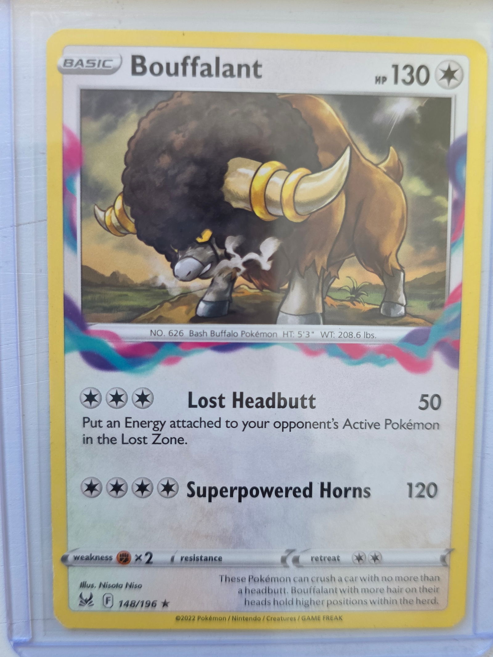 2022 Bouffalant Lost Origin 148/196 Rare Pokemon Card: 2022 Pokemon Bouffalant card numbered 148/196 from the Sword & Shield Lost Origin expansion set. Illustrated by Nisota Niso. Colorless type Basic Pokemon featuring the attacks Lost Headbutt and Superp