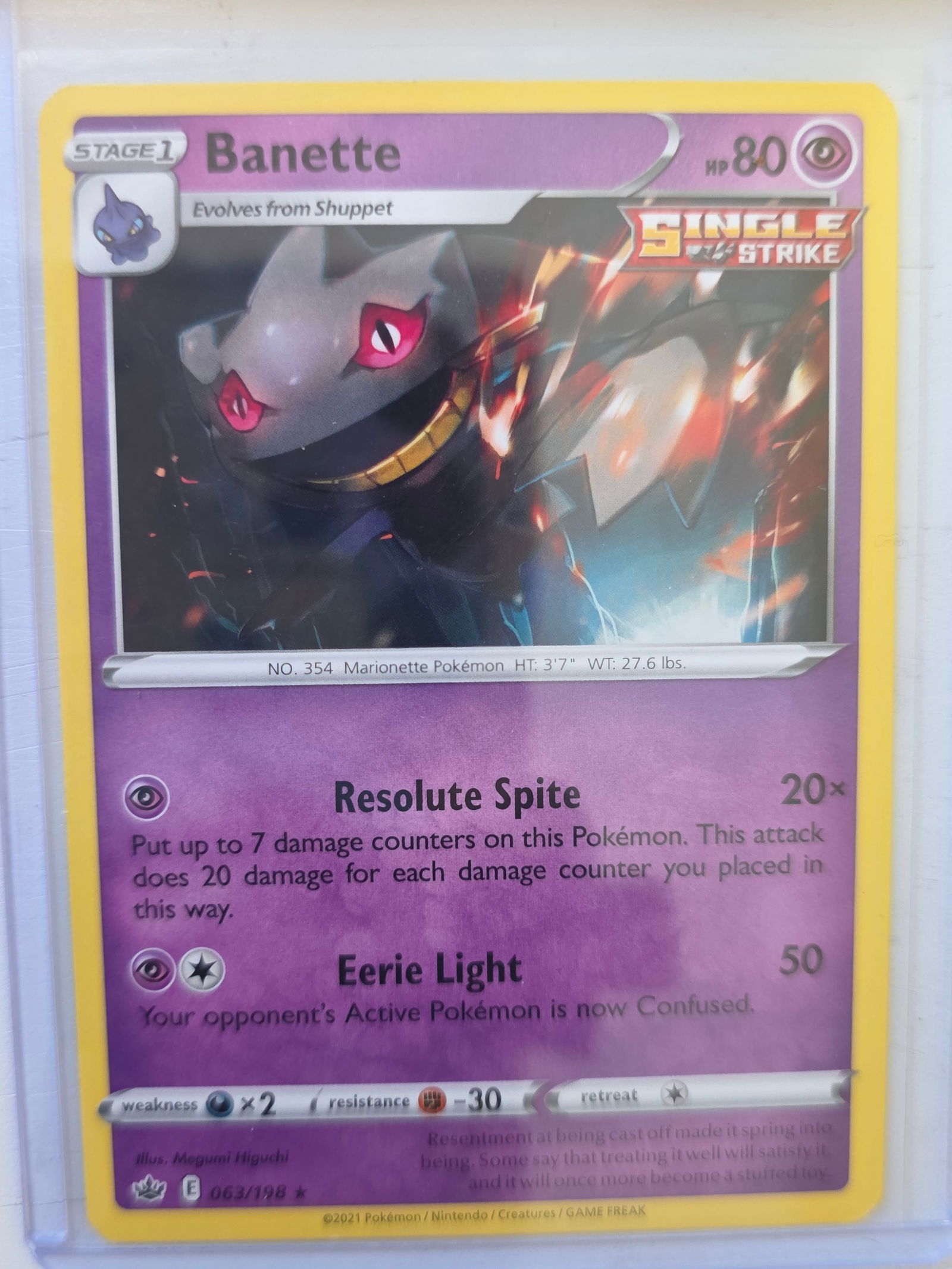 2021 Banette Chilling Reign 063/198 Rare Pokemon Card: 2021 Pokemon Banette card numbered 063/198 from the Sword & Shield Chilling Reign expansion set. Single Strike marked card illustrated by Megumi Higuchi. Stage 1 Psychic type Pokemon evolving from Shu