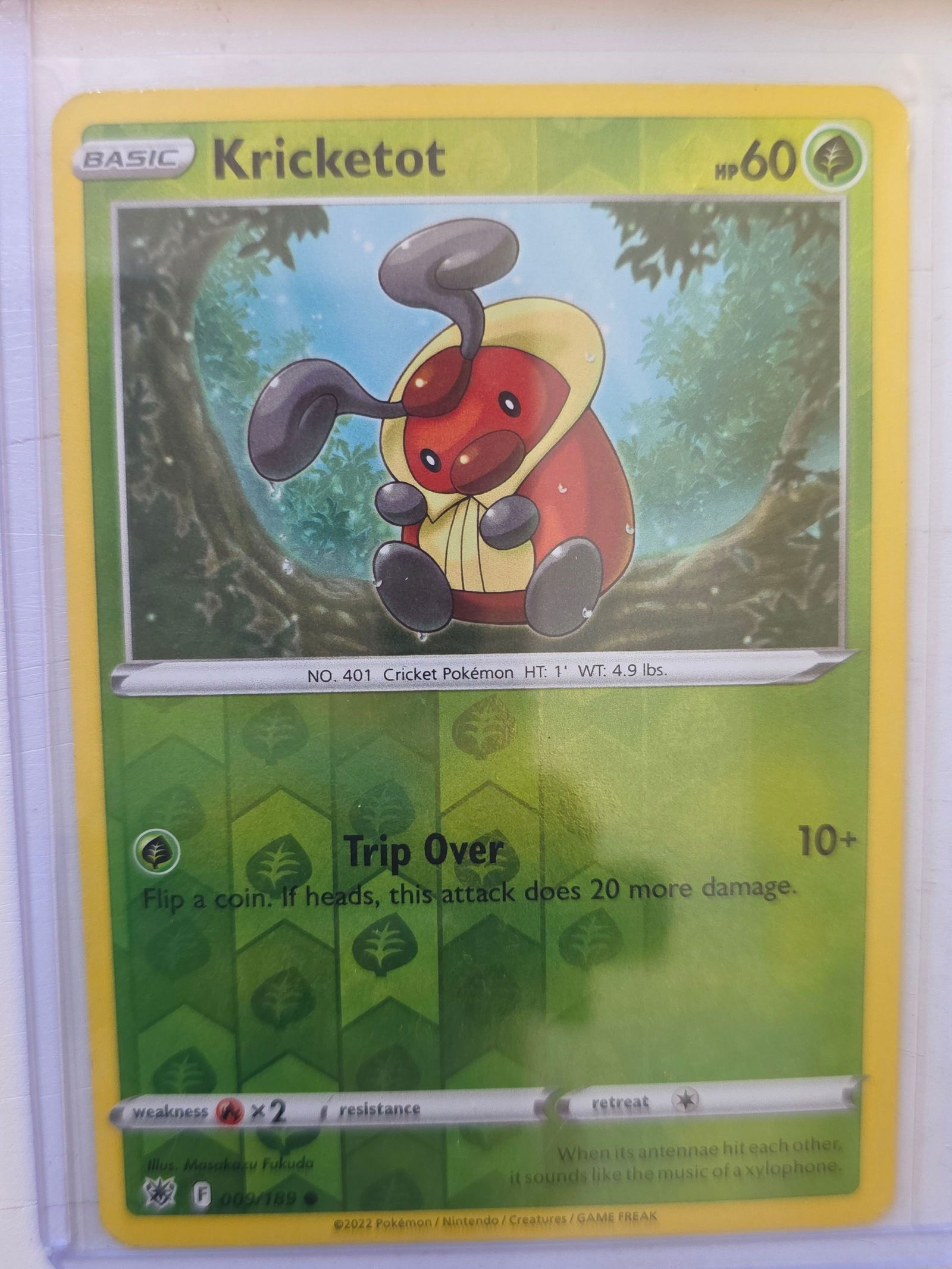 2022 Kricketot Astral Radiance 009/189 Reverse Holo Pokemon Card: 2022 Pokemon Kricketot reverse holo card numbered 009/189 from the Sword & Shield Astral Radiance expansion set. Illustrated by Masakazu Fukuda. Reverse holographic foil pattern across the card surfac