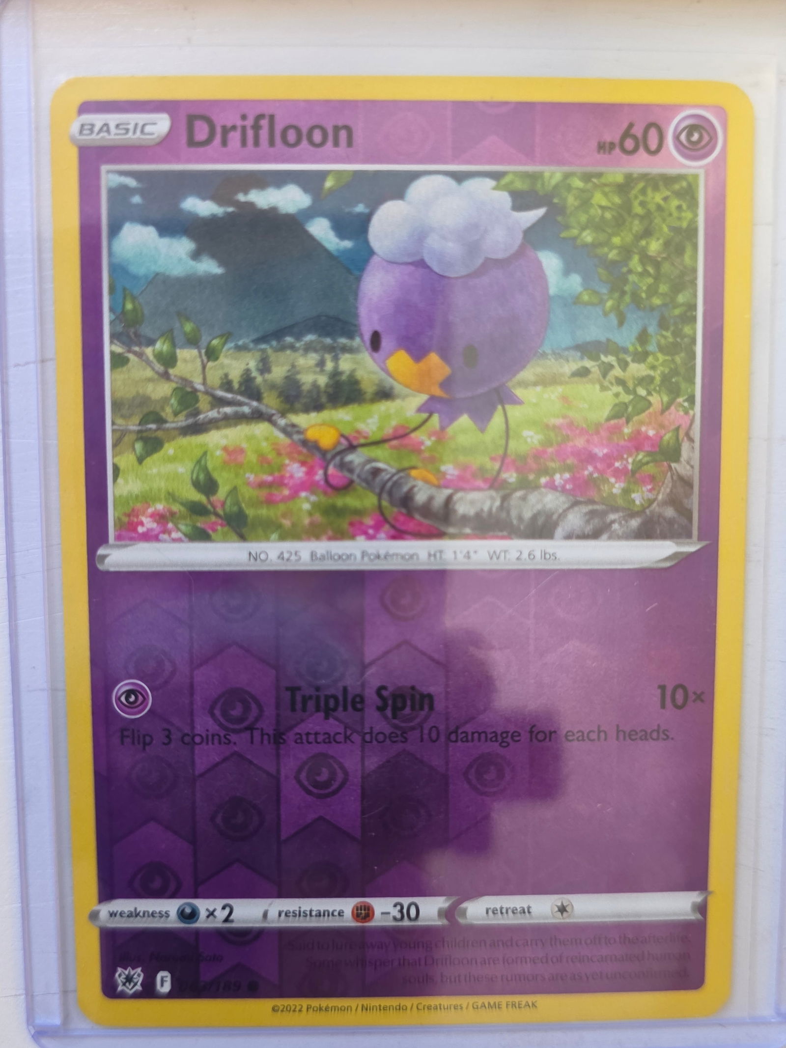 2022 Drifloon Silver Tempest 089/195 Reverse Holo Pokemon Card: 2022 Pokemon Drifloon reverse holo card numbered 089/195 from the Sword & Shield Silver Tempest expansion set. Illustrated by Narumi Sato. Reverse holographic foil pattern across the card surface. Car