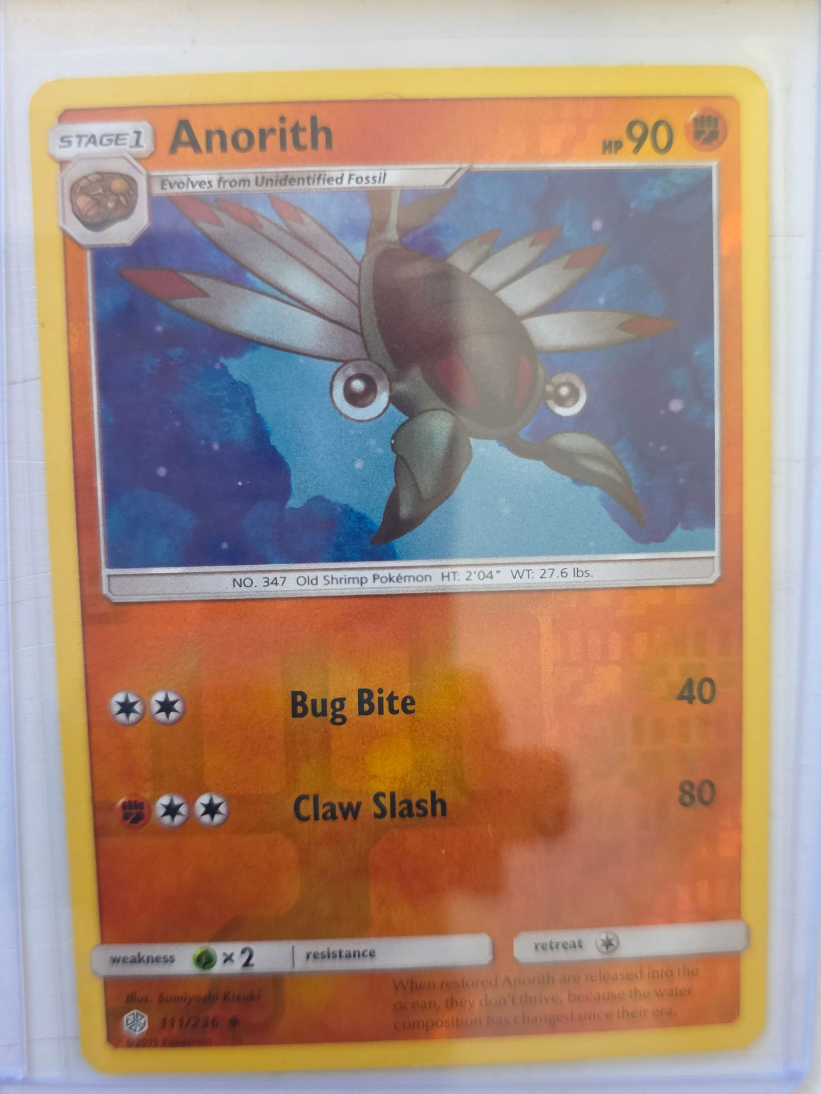 2019 Anorith Cosmic Eclipse 111/236 Reverse Holo Pokemon Card: 2019 Pokemon Anorith reverse holo card numbered 111/236 from the Sun & Moon Cosmic Eclipse expansion set. Illustrated by Sumiyoshi Kizuki. Reverse holographic foil pattern across the card surface. Car