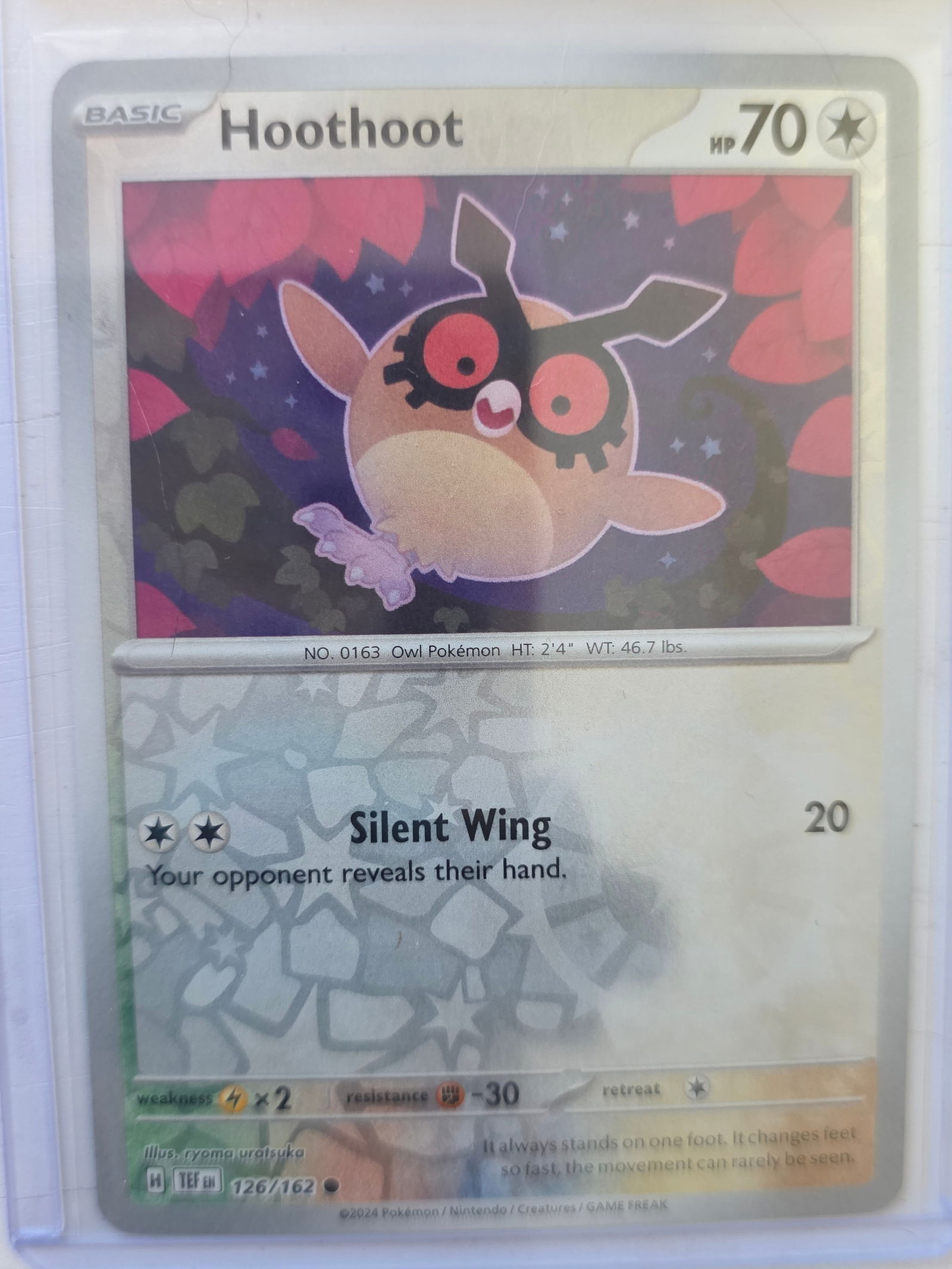 2024 Hoothoot Temporal Forces 126/162 Reverse Holo Pokemon Card: 2024 Pokemon Hoothoot reverse holo card numbered 126/162 from the Scarlet & Violet Temporal Forces expansion set. Illustrated by Ryoma Uratsuka. Reverse holographic foil pattern across the card surfac