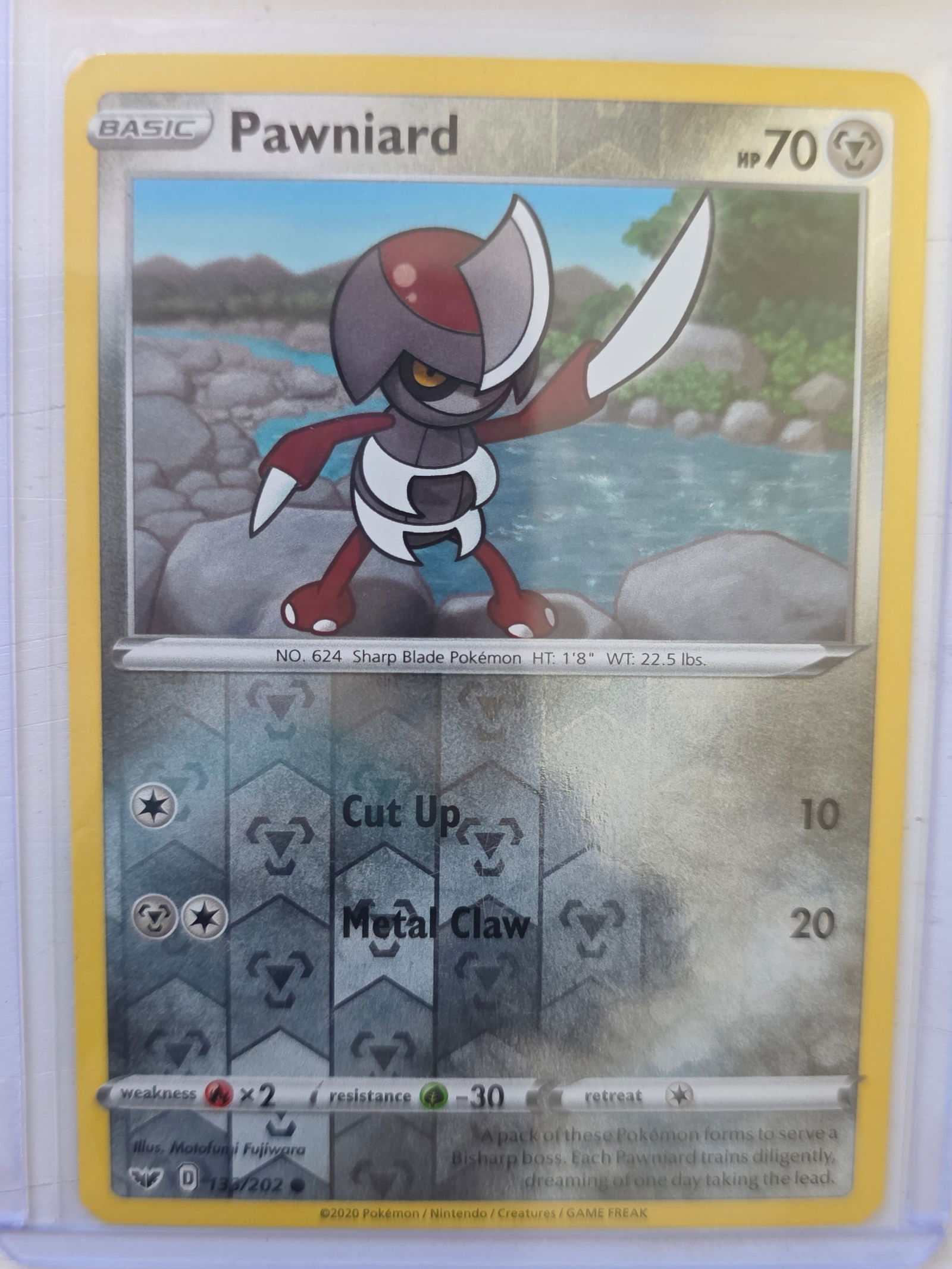 2020 Pawniard Darkness Ablaze 135/189 Reverse Holo Pokemon Card: 2020 Pokemon Pawniard reverse holo card numbered 135/189 from the Sword & Shield Darkness Ablaze expansion set. Illustrated by Motofumi Fujiwara. Reverse holographic foil pattern across the card surfa