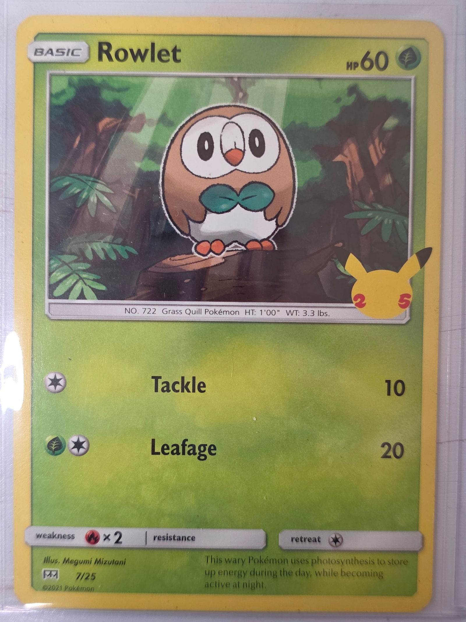 2021 Rowlet McDonalds 25th Anniversary 7/25 Pokemon Card: 2021 Pokemon Rowlet promotional card numbered 7/25 from the McDonalds 25th Anniversary Pokemon TCG promotion set. Illustrated by Megumi Mizutani. Card stored in penny sleeve and top loader.