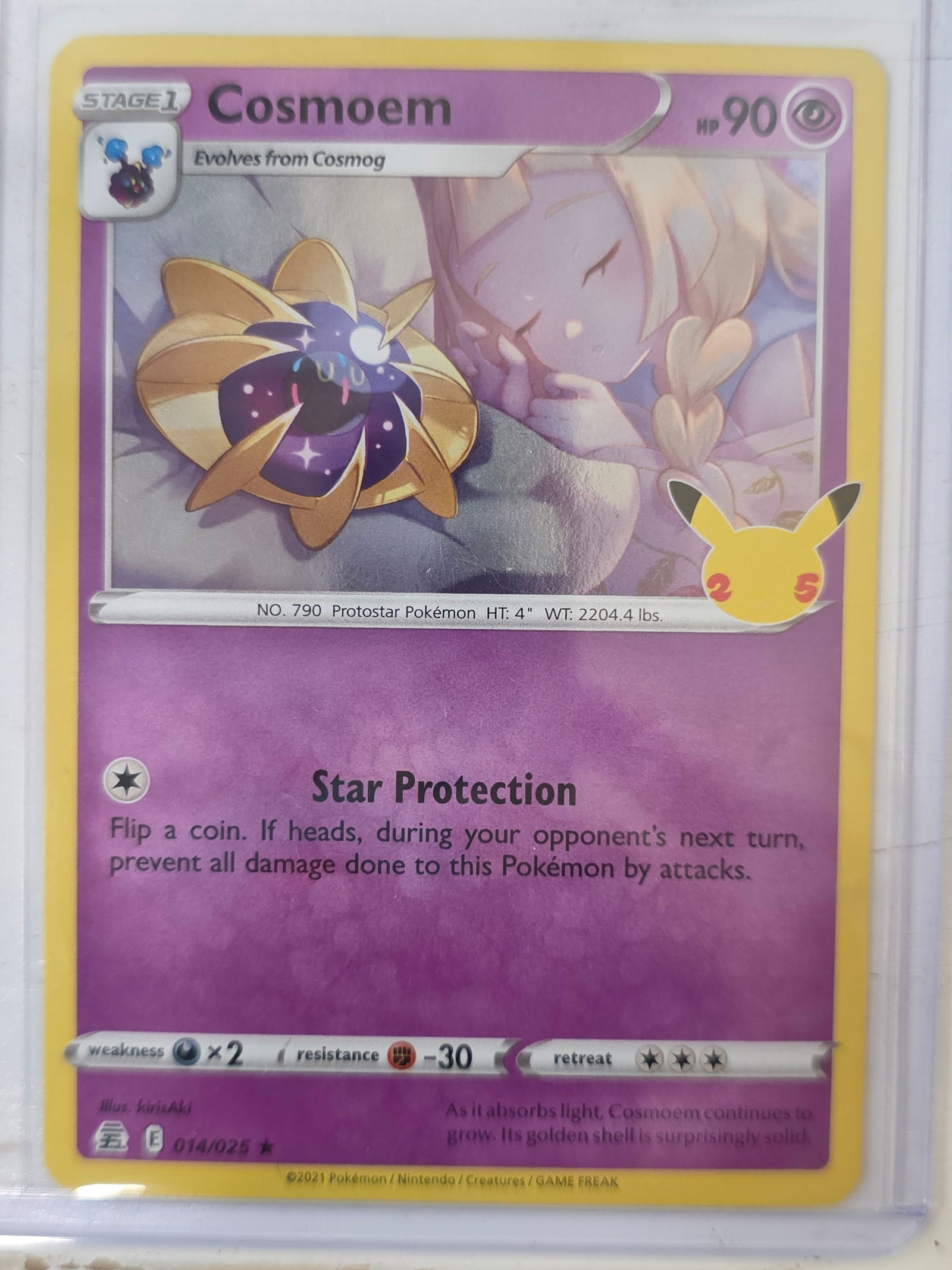 2021 Cosmoem Celebrations 014/025 Holo Pokemon Card: 2021 Pokemon Cosmoem holographic card numbered 014/025 from the Celebrations expansion set released for the Pokemon 25th Anniversary. Illustrated by kirisAki. Holographic foil finish across the card s