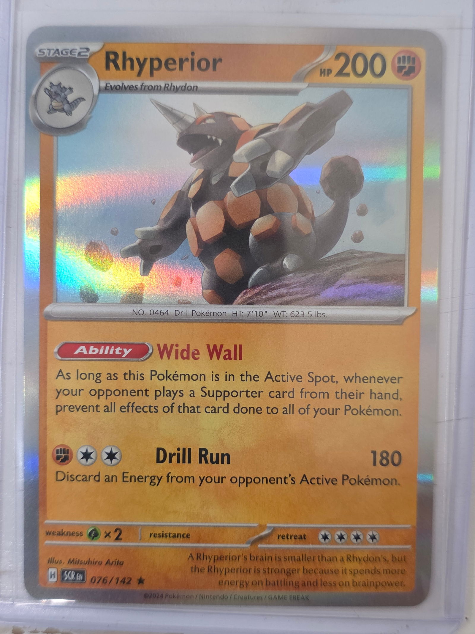 2024 Rhyperior Stellar Crown 076/142 Reverse Holo Pokemon Card: 2024 Pokemon Rhyperior reverse holo card numbered 076/142 from the Scarlet & Violet Stellar Crown expansion set. Illustrated by Mitsuhiro Arita. Reverse holographic foil pattern across the card surfac