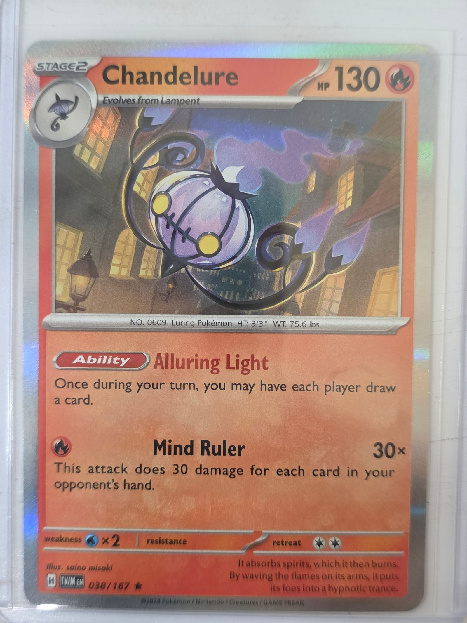 2024 Chandelure Twilight Masquerade 038/167 Holo Pokemon Card: 2024 Pokemon Chandelure holographic card numbered 038/167 from the Scarlet & Violet Twilight Masquerade expansion set. Illustrated by saino misaki. Standard holographic rare finish across the illustra