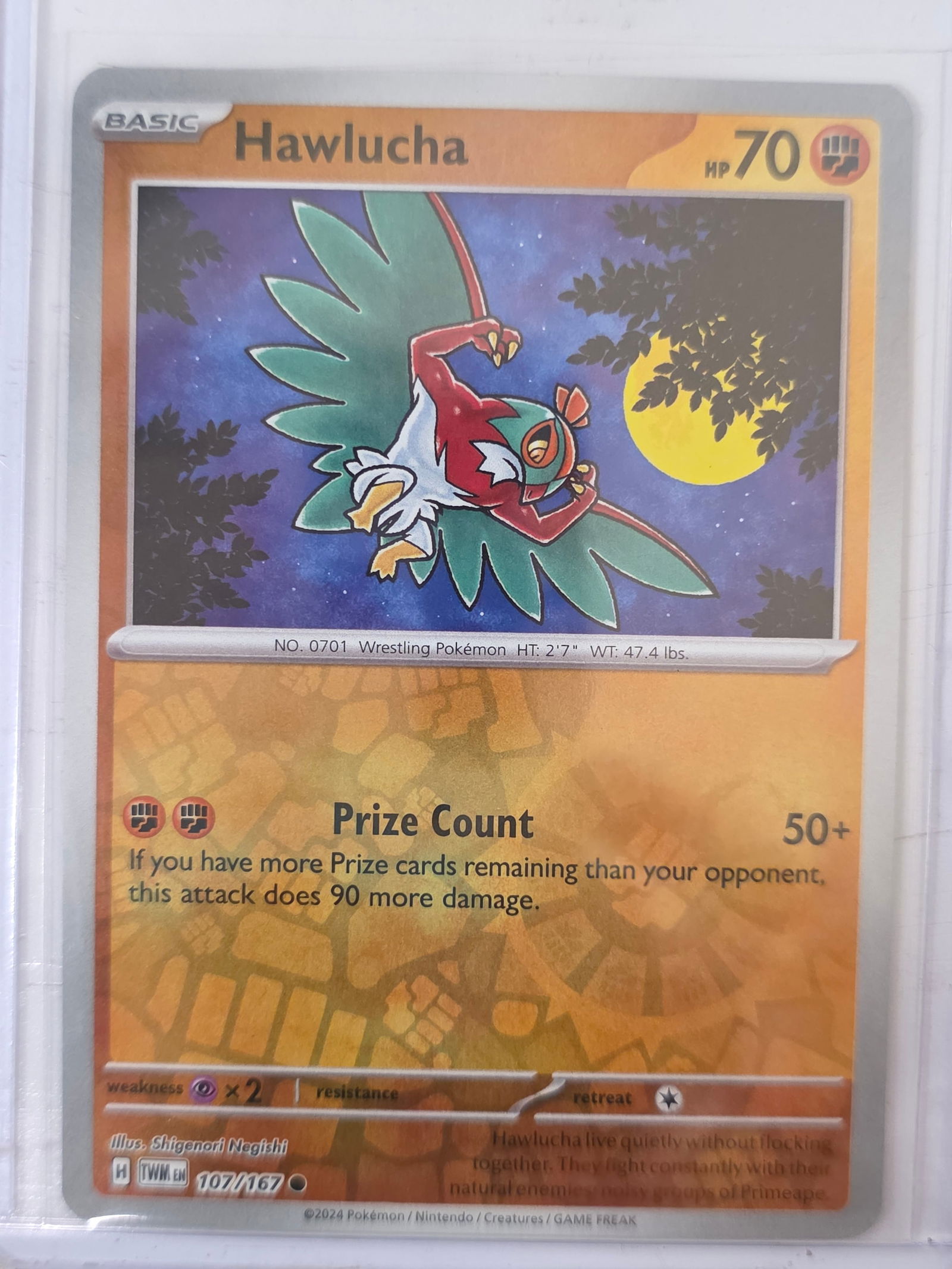 2024 Hawlucha Twilight Masquerade 107/167 Reverse Holo Pokemon Card: 2024 Pokemon Hawlucha reverse holo card numbered 107/167 from the Scarlet & Violet Twilight Masquerade expansion set. Illustrated by Shigenori Negishi. Reverse holographic foil pattern across the card