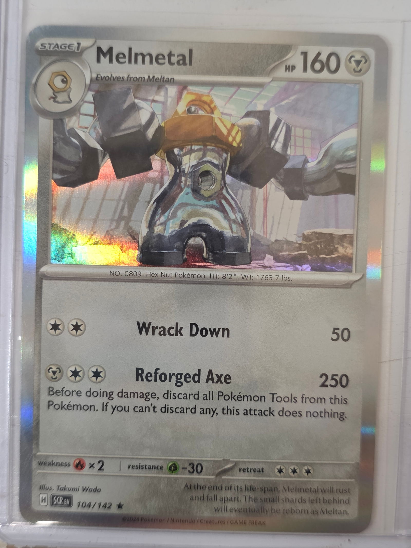 2024 Melmetal Stellar Crown 104/142 Holo Pokemon Card: 2024 Pokemon Melmetal holographic card numbered 104/142 from the Scarlet & Violet Stellar Crown expansion set. Illustrated by Takumi Wada. Standard holographic rare finish across the illustration area