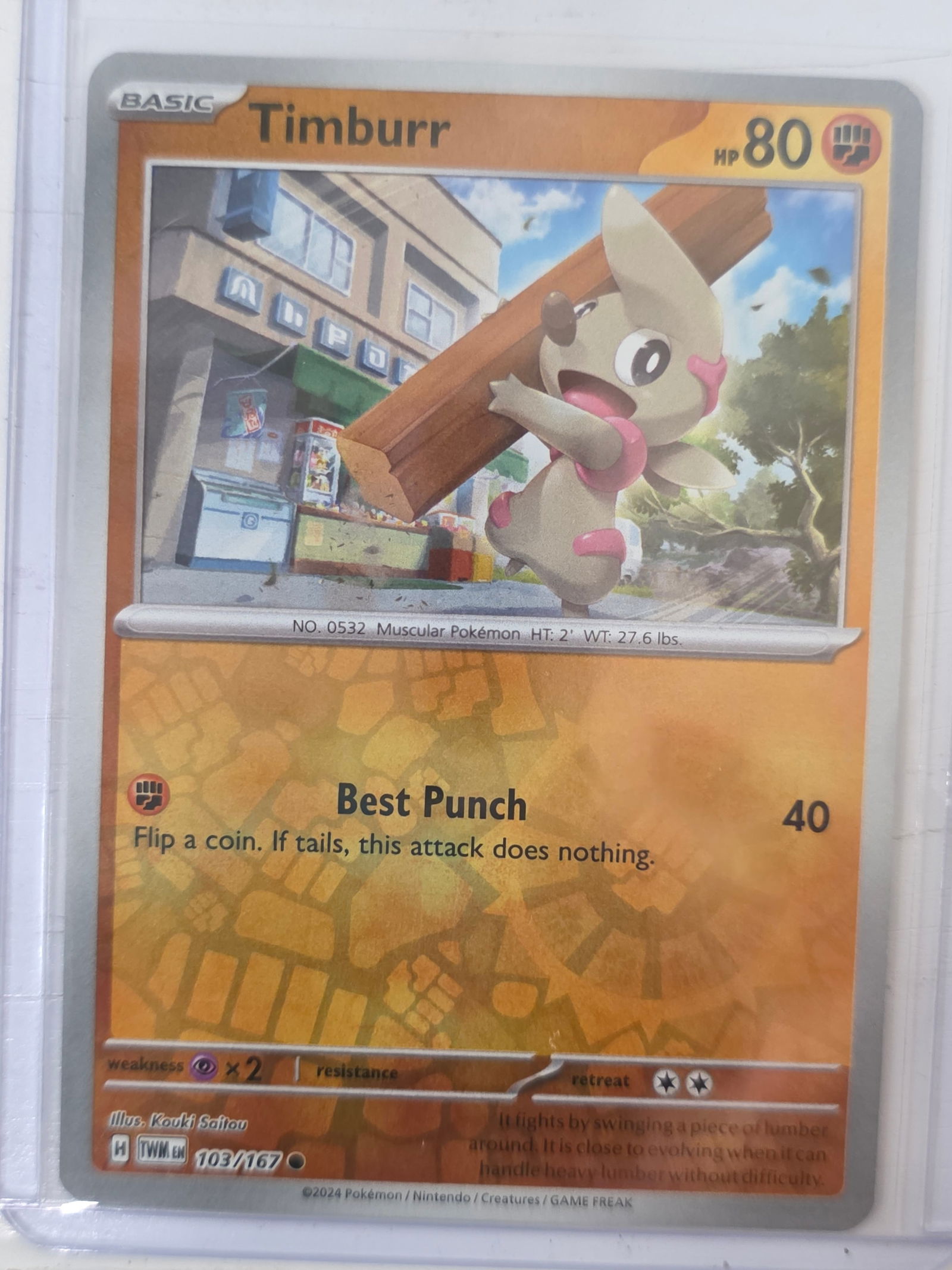 2024 Timburr Twilight Masquerade 103/167 Reverse Holo Pokemon Card: 2024 Pokemon Timburr reverse holo card numbered 103/167 from the Scarlet & Violet Twilight Masquerade expansion set. Illustrated by Kouki Saitou. Reverse holographic foil pattern across the card surfa