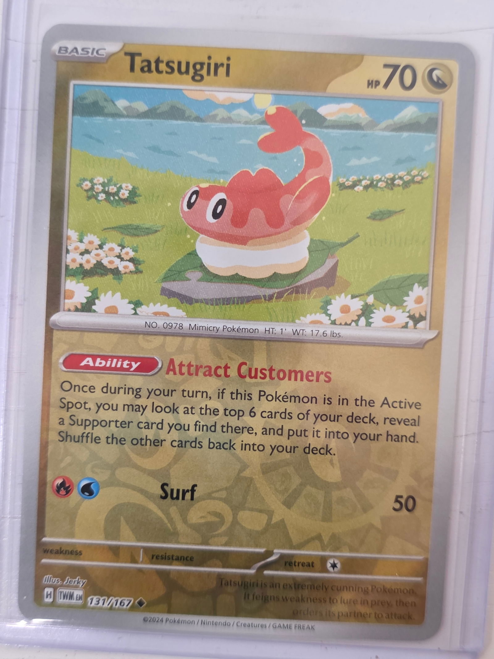 2024 Tatsugiri Twilight Masquerade 131/167: 2024 Pokemon Tatsugiri card numbered 131/167 from the Scarlet & Violet Twilight Masquerade expansion set. Illustrated by Jerky. Card stored in penny sleeve and top loader.