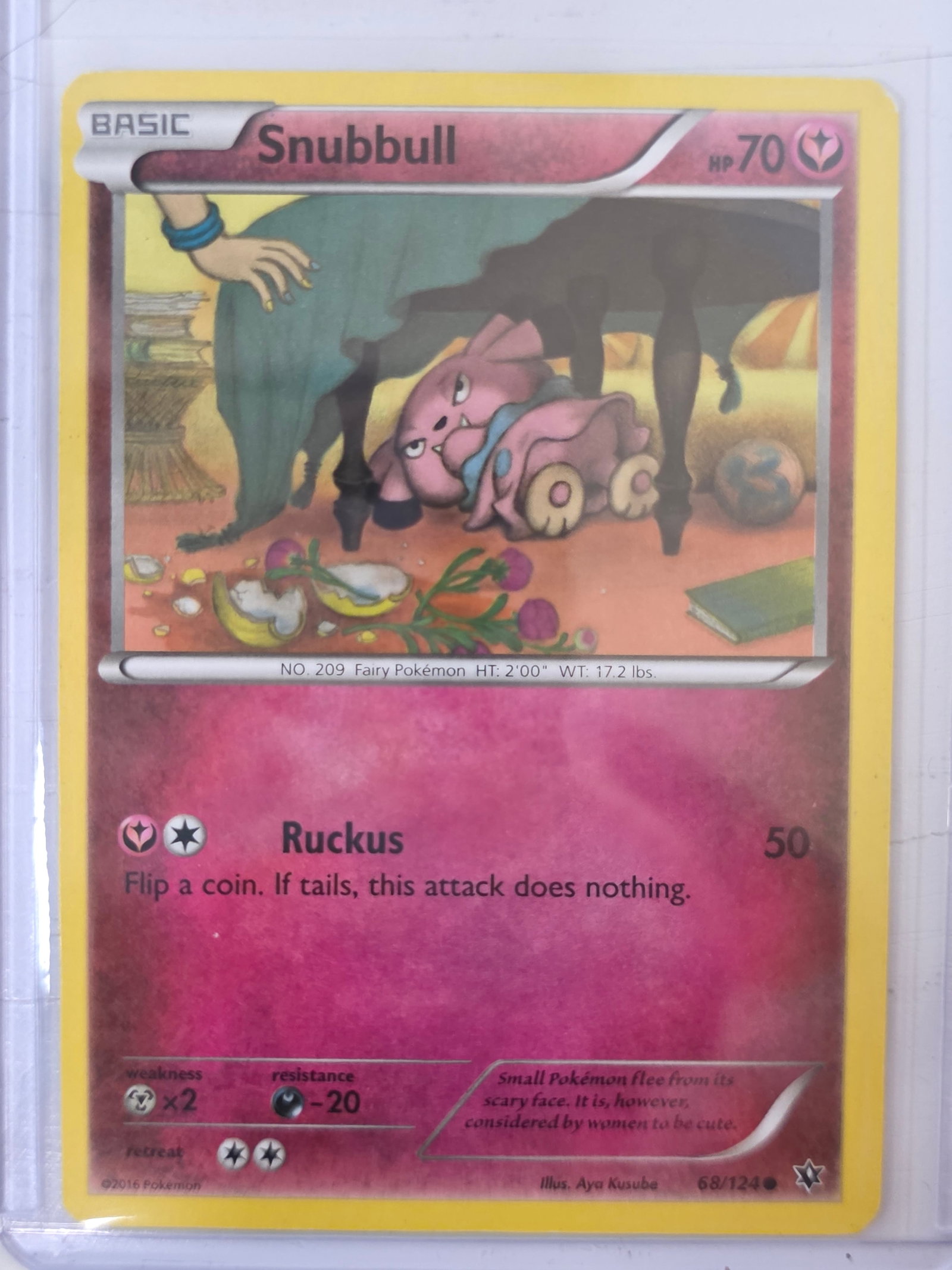 2016 Snubbull Fates Collide 68/124: 2016 Pokemon Snubbull card numbered 68/124 from the XY Fates Collide expansion set. Illustrated by Aya Kusube. Card stored in penny sleeve and top loader.