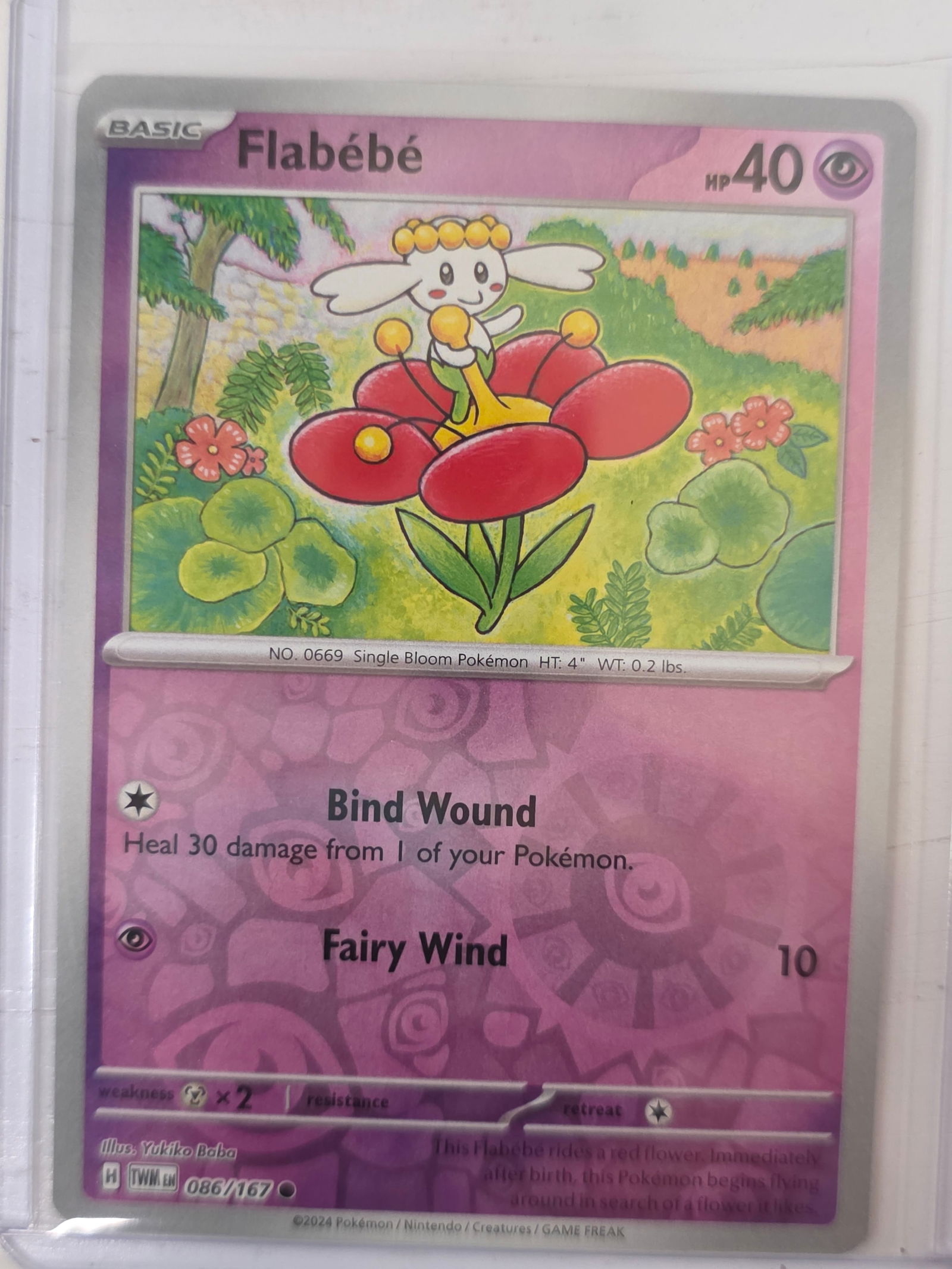 2024 Flabebe Temporal Forces 086/167 Reverse Holo Pokemon Card: 2024 Pokemon Flabebe card from the Temporal Forces set numbered 086/167. Reverse holo card stored in penny sleeve and top loader.