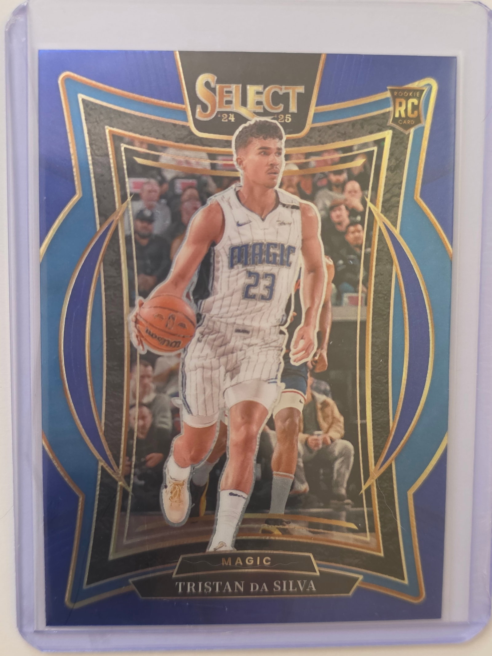 Tristan da Silva ROOKIE 2024 Select Concourse Orlando Magic #83: 2024 Panini Select Tristan da Silva Concourse Rookie #83 for the Orlando Magic. Clean example with strong color and surface. Stored in protective sleeve and holder. See photos for centering and edges.